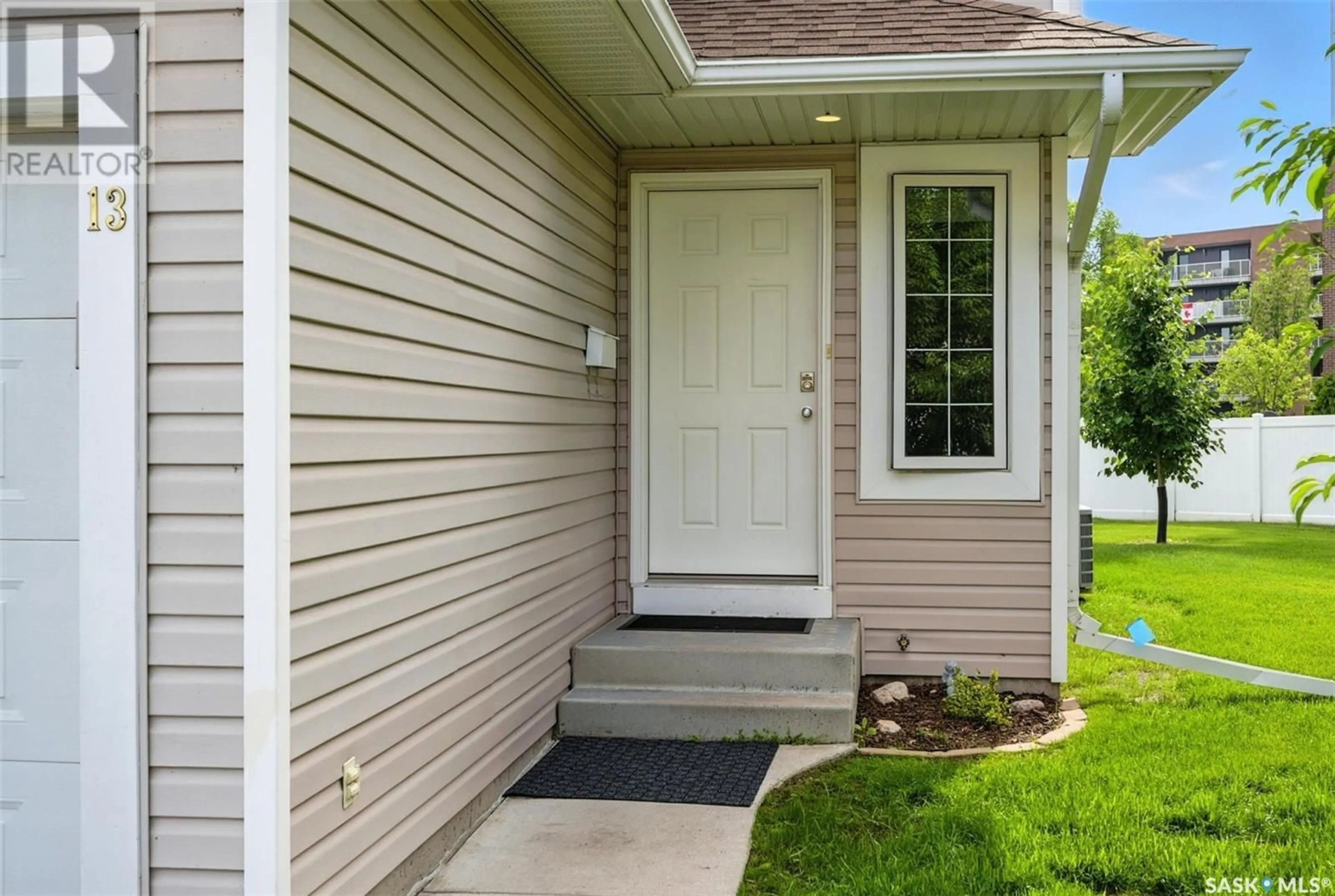 Home with vinyl exterior material, street for 13 215 PINEHOUSE DRIVE, Saskatoon Saskatchewan S7K6N9