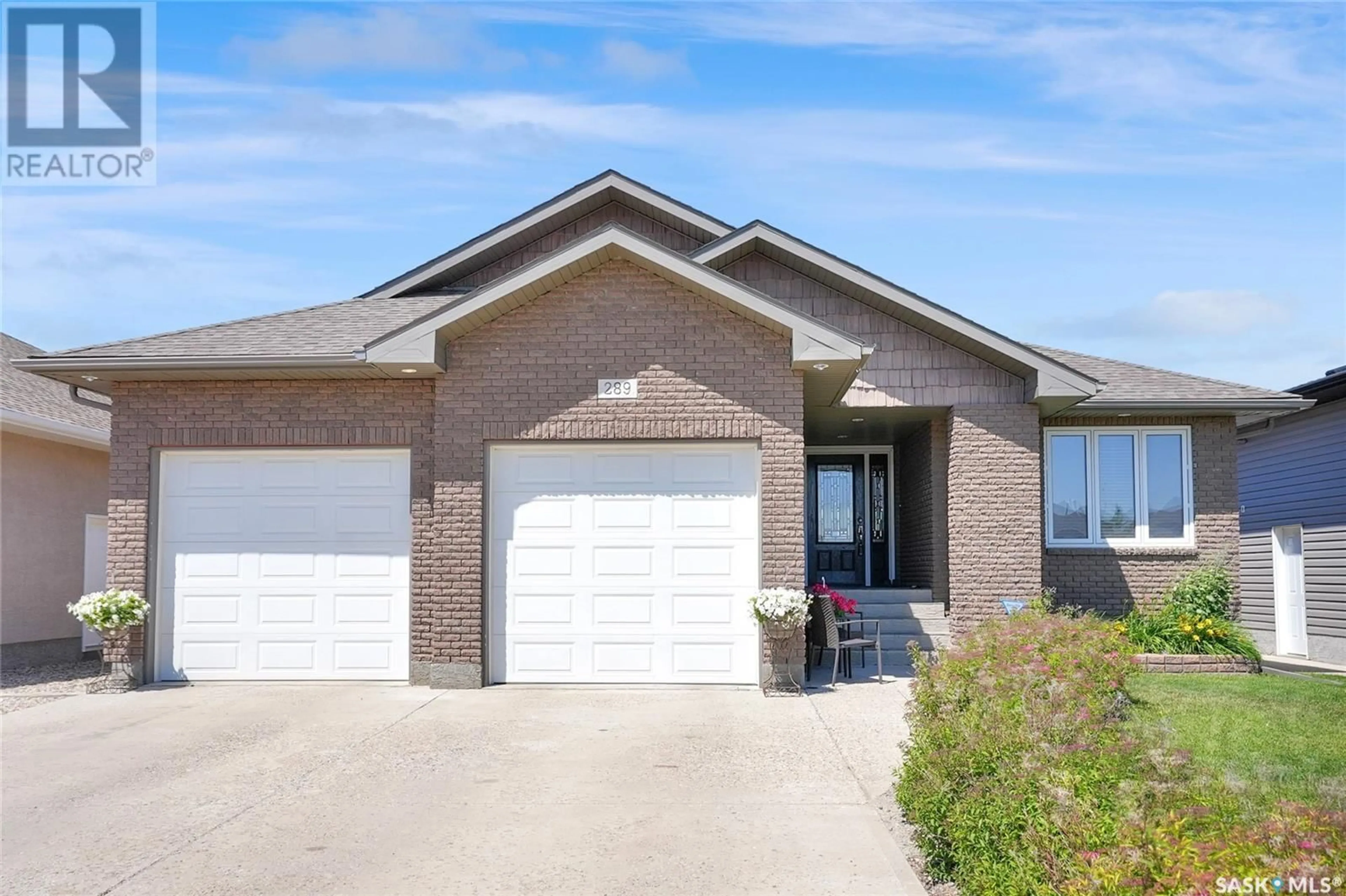 Home with brick exterior material, street for 289 WOOD LILY DRIVE, Moose Jaw Saskatchewan S6J1N9
