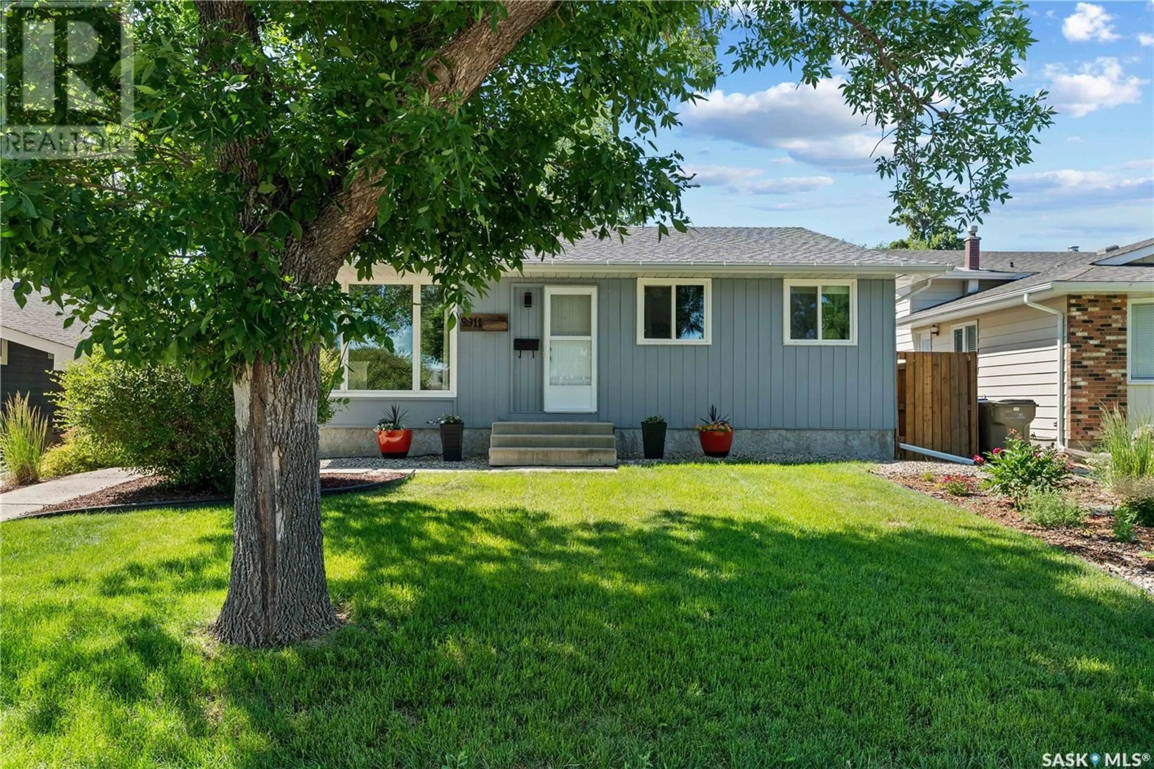 Home with vinyl exterior material, street for 6911 1ST AVENUE, Regina Saskatchewan S4X1C8