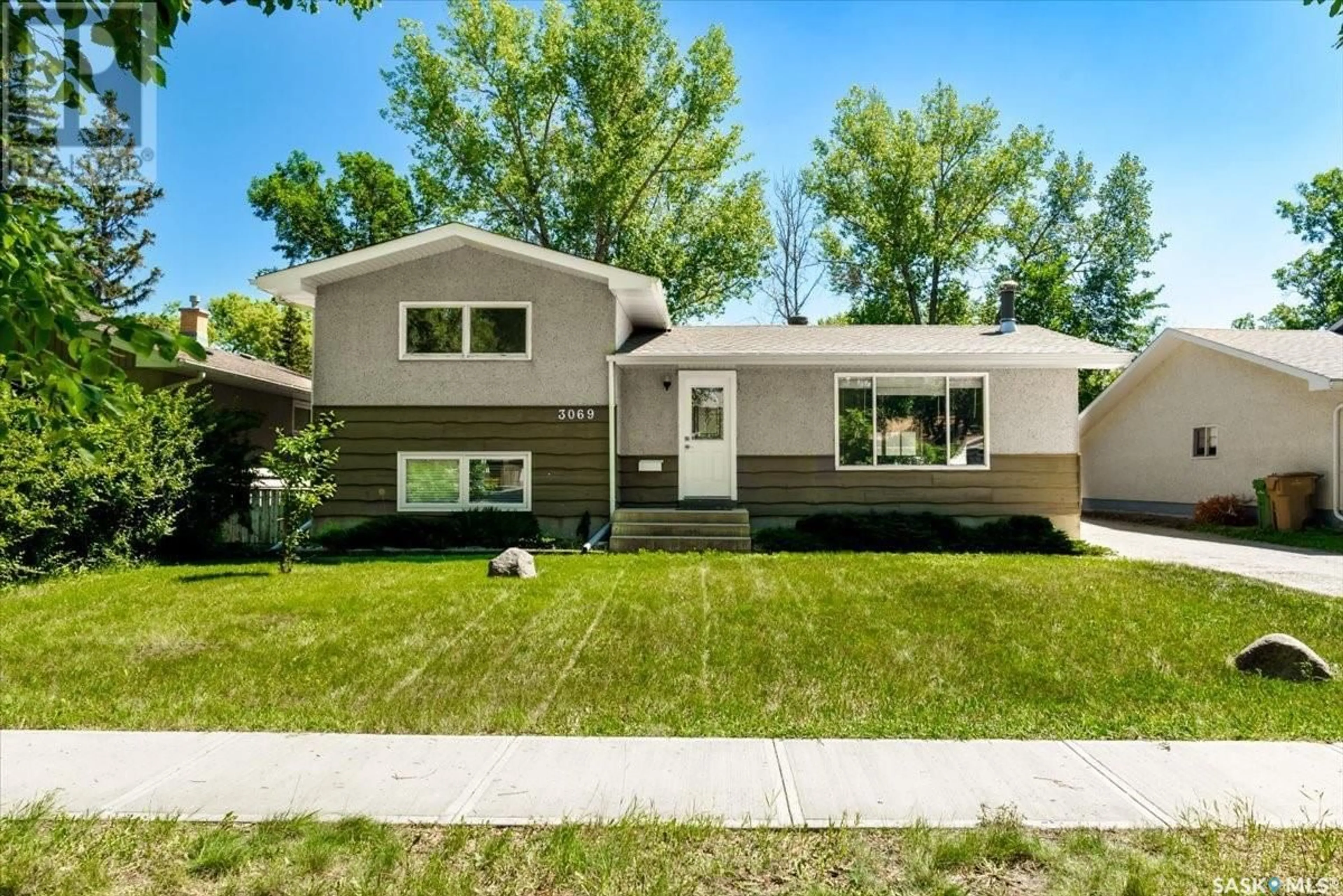 Home with vinyl exterior material, street for 3069 GRANT ROAD, Regina Saskatchewan S4S5G9