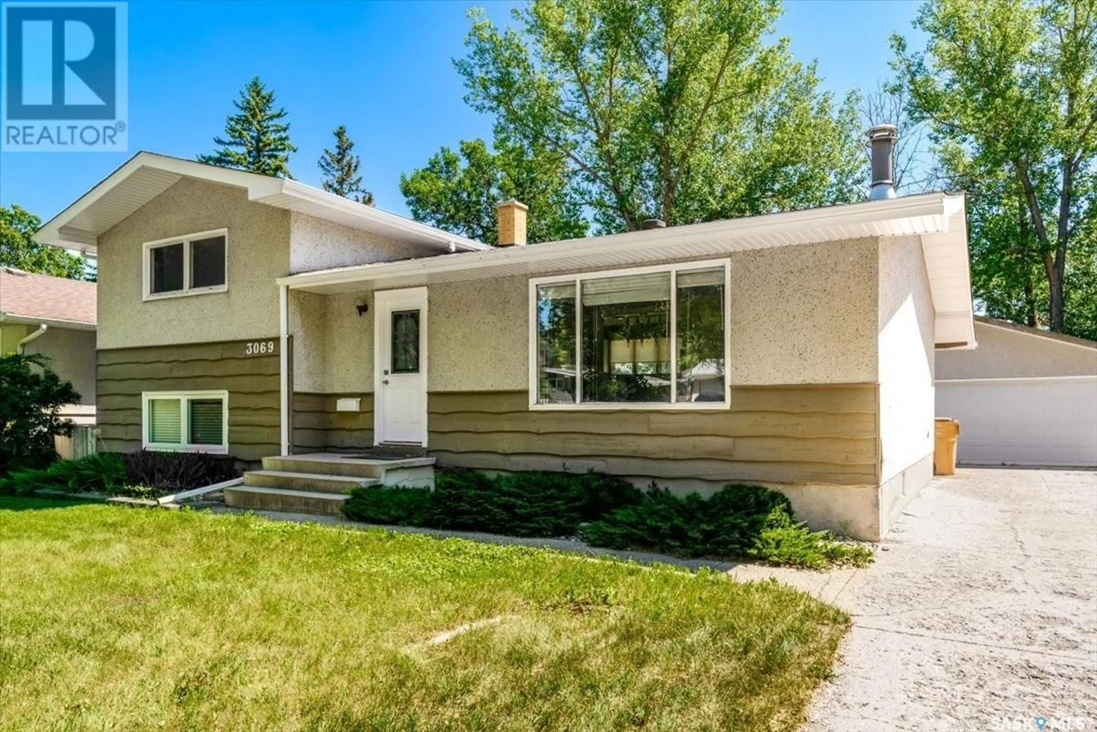 Home with vinyl exterior material, street for 3069 GRANT ROAD, Regina Saskatchewan S4S5G9