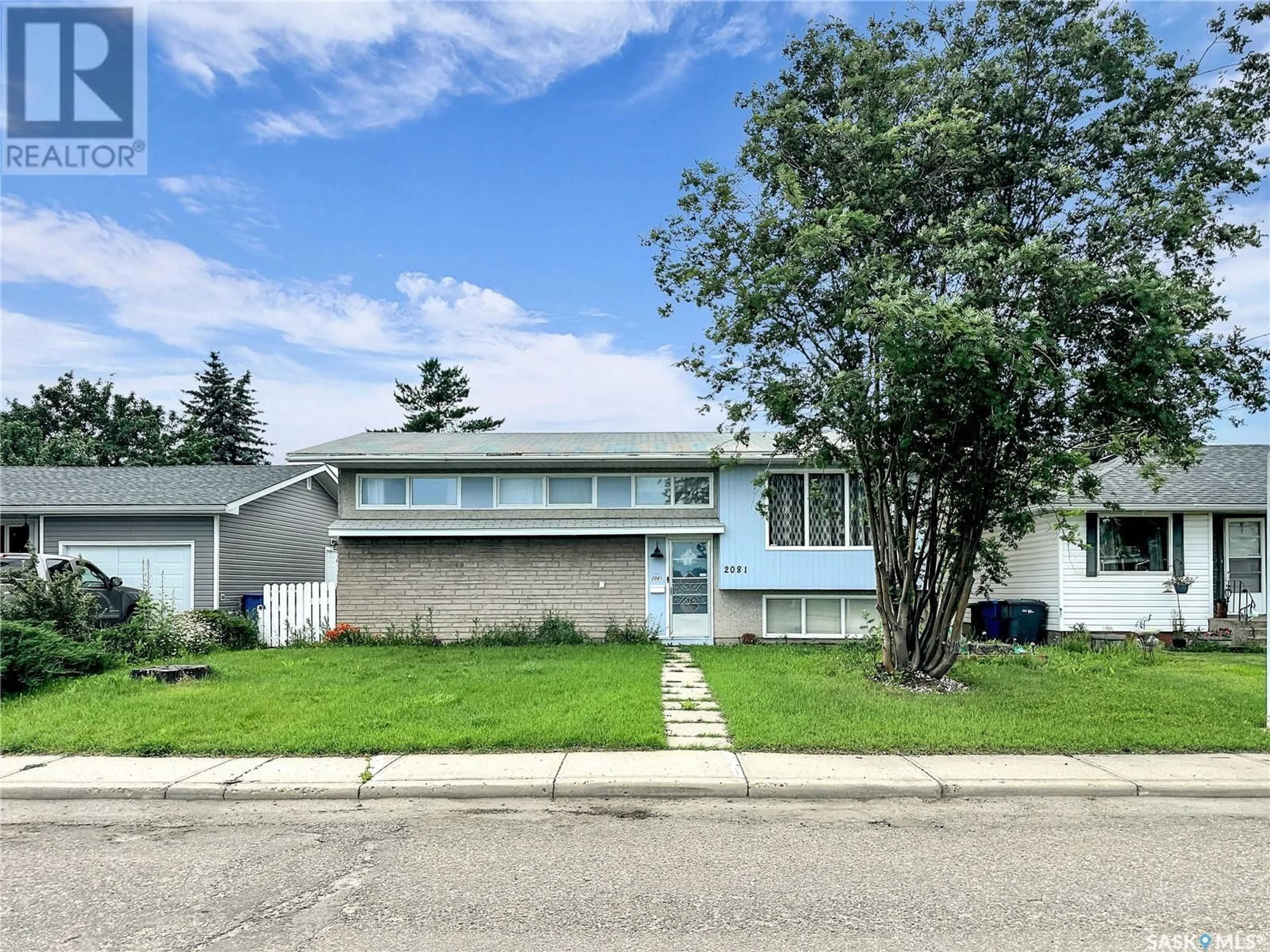 Home with vinyl exterior material, street for 2081 102ND STREET, North Battleford Saskatchewan S9A1H8