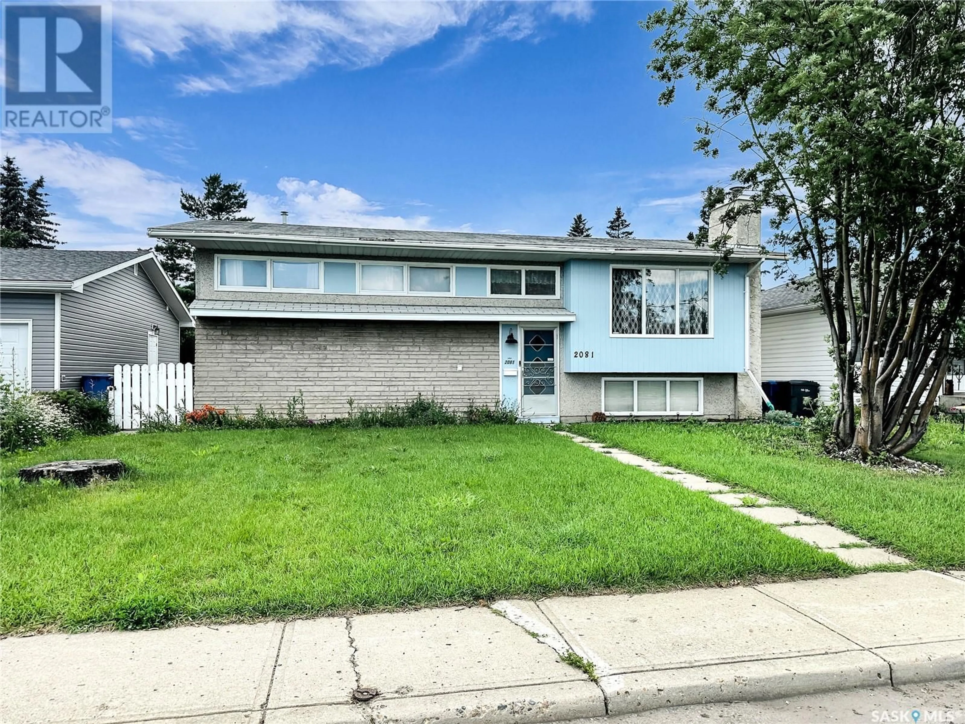 Home with vinyl exterior material, street for 2081 102ND STREET, North Battleford Saskatchewan S9A1H8