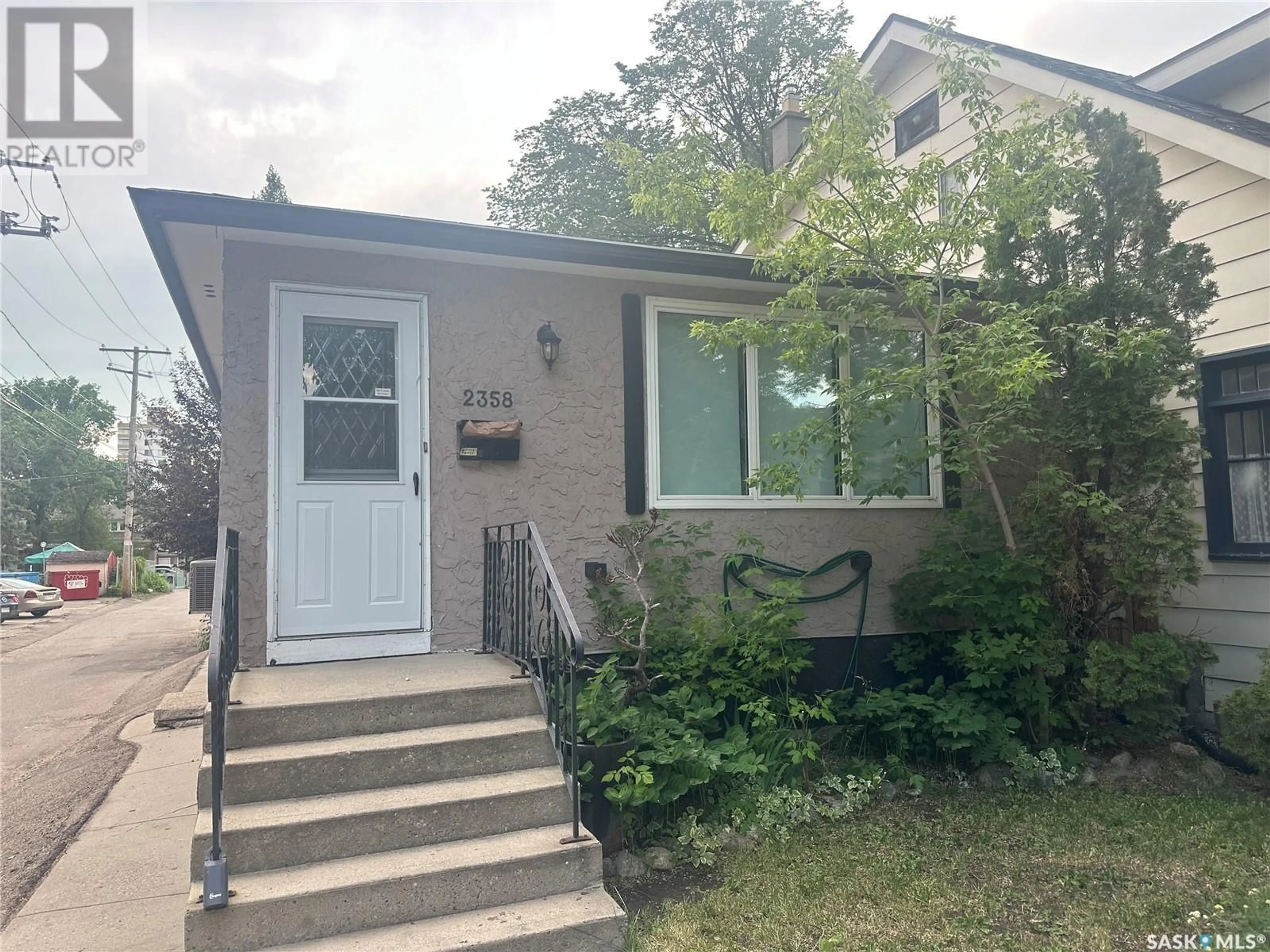 Home with vinyl exterior material, street for 2358 HALIFAX STREET, Regina Saskatchewan S4P1V4
