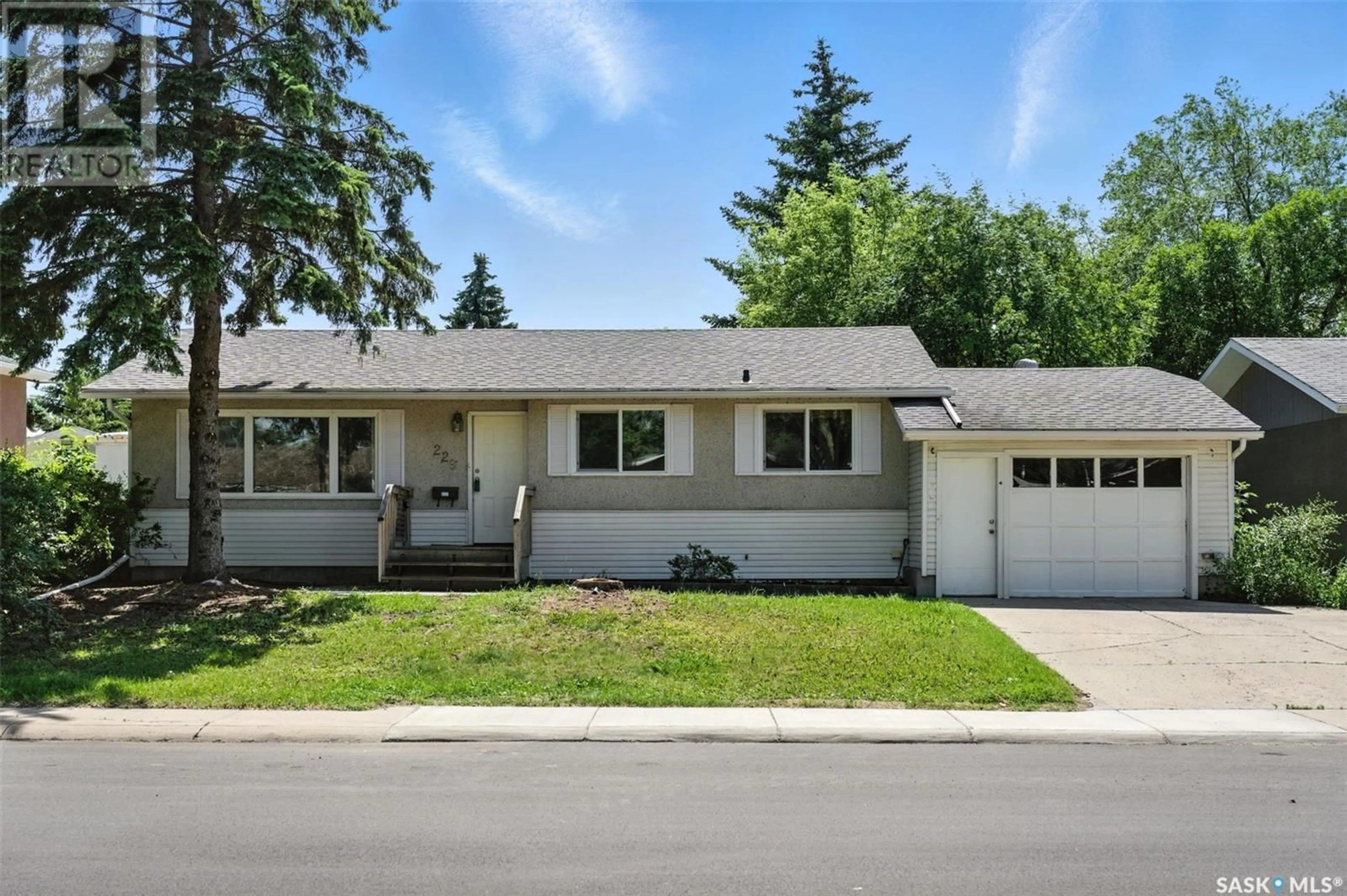 Home with vinyl exterior material, street for 229 CARLETON DRIVE, Saskatoon Saskatchewan S7H3P1