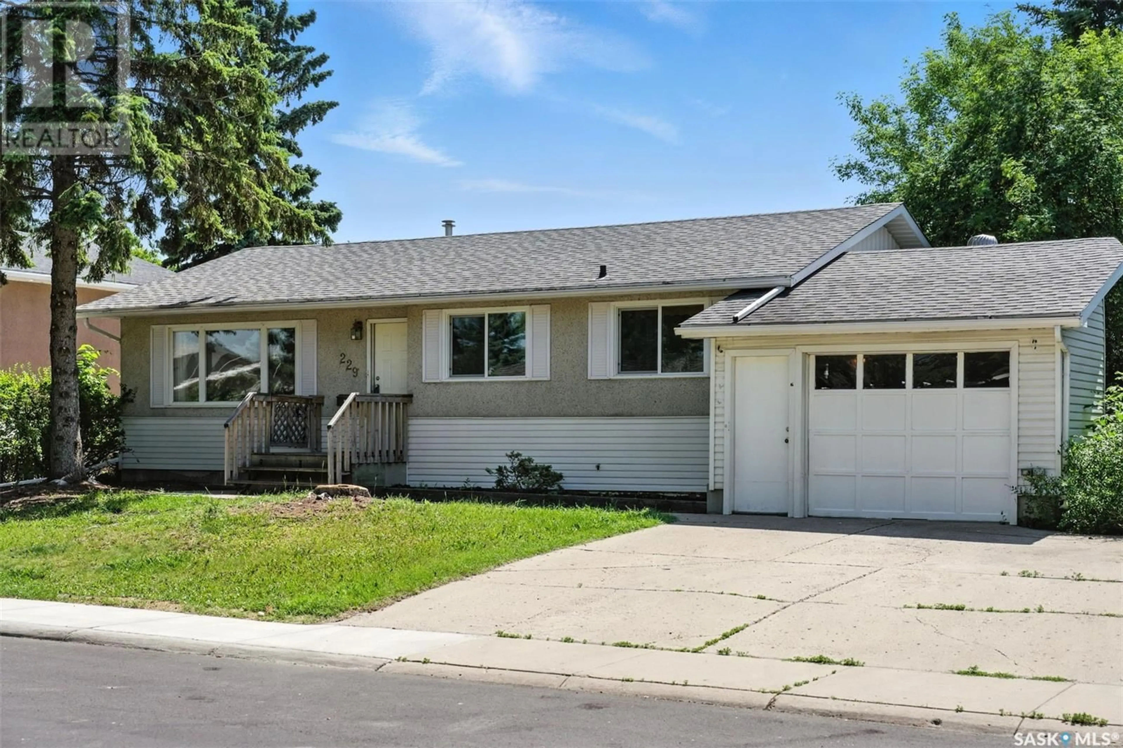 Home with vinyl exterior material, street for 229 CARLETON DRIVE, Saskatoon Saskatchewan S7H3P1
