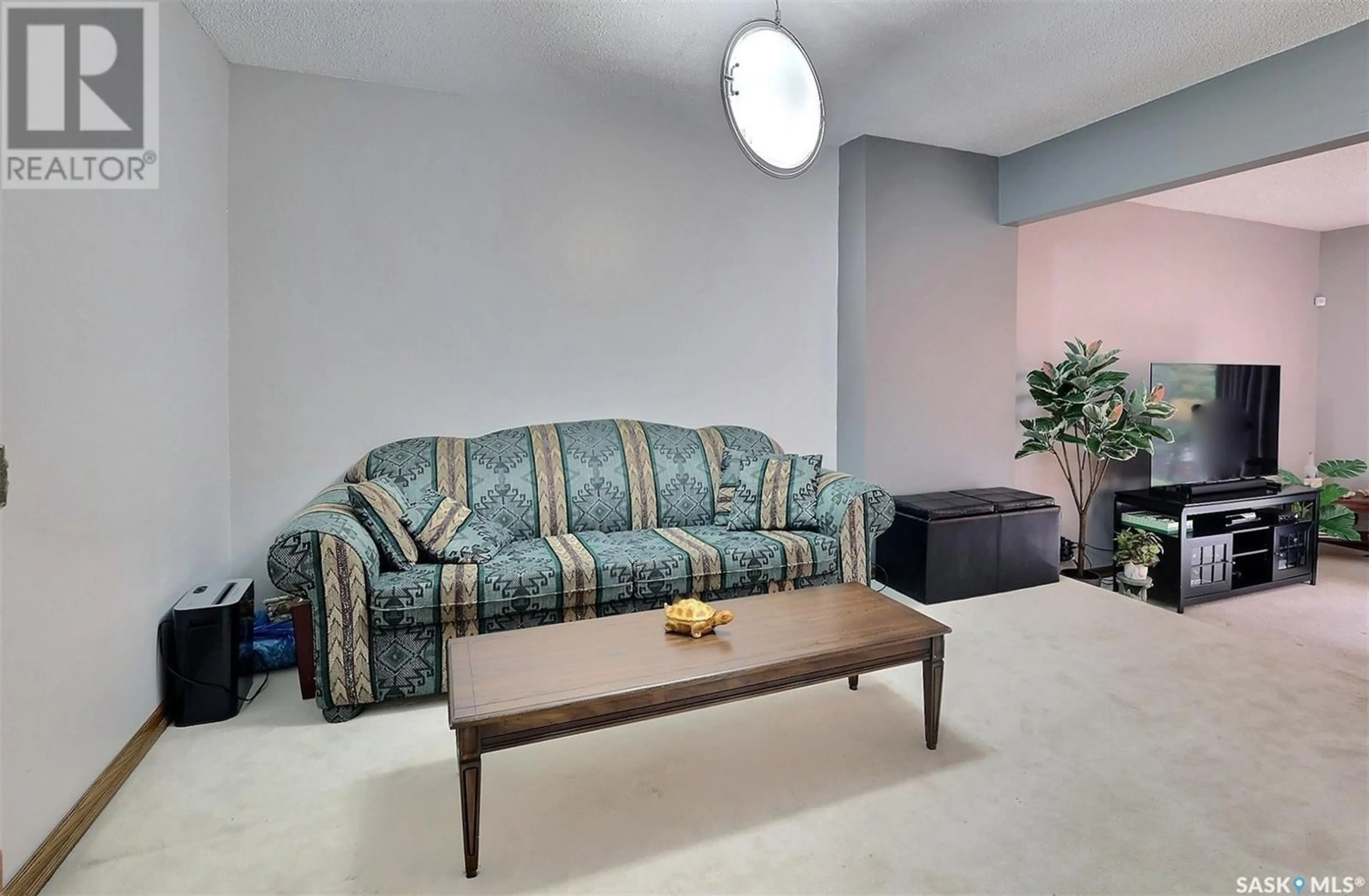 Living room with furniture, carpet floor for 47 LAVERENDRYE WAY, Regina Saskatchewan S4S5Z6