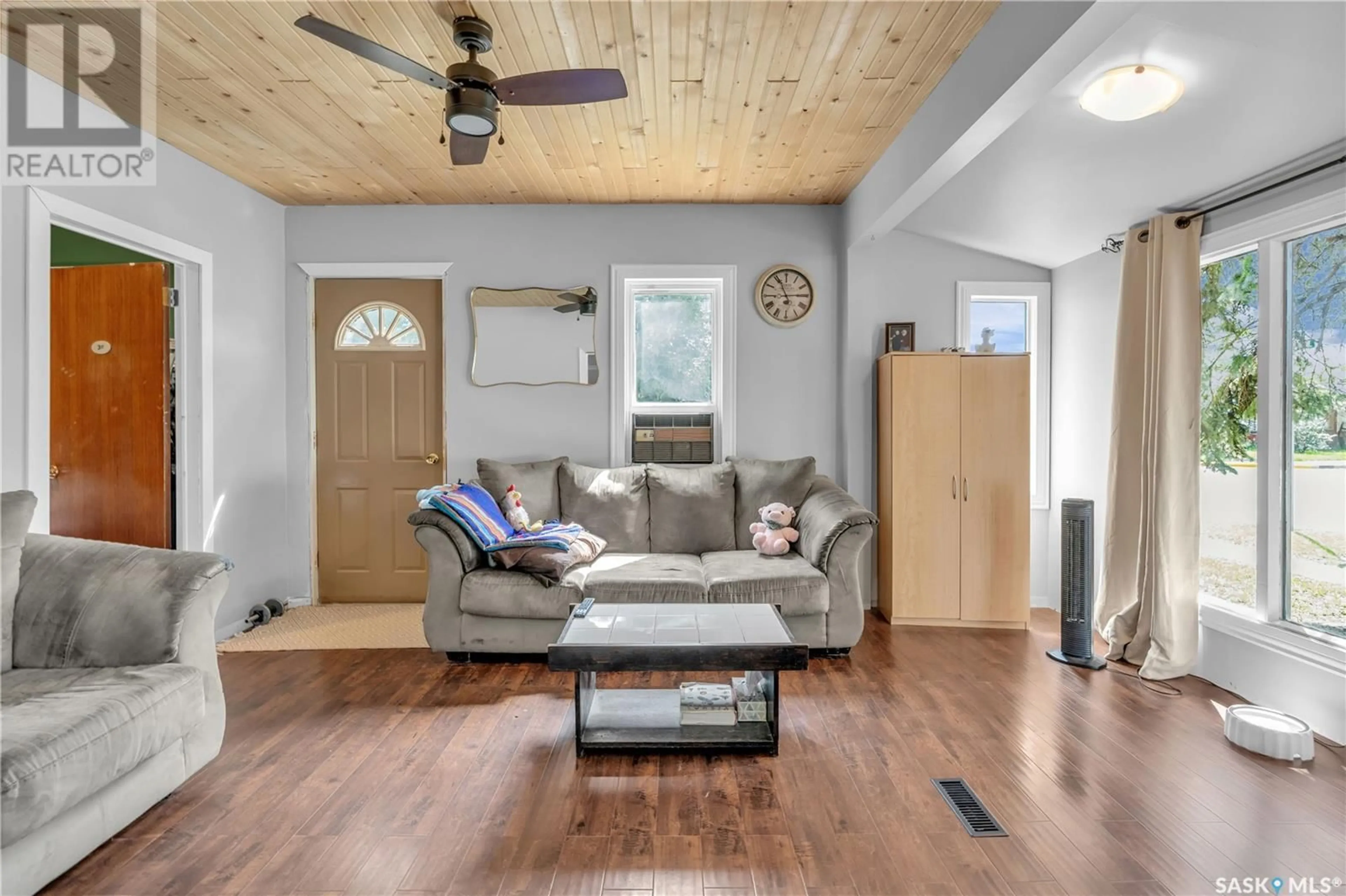 Living room with furniture, wood/laminate floor for 207 3RD STREET, Dalmeny Saskatchewan S0K1E0