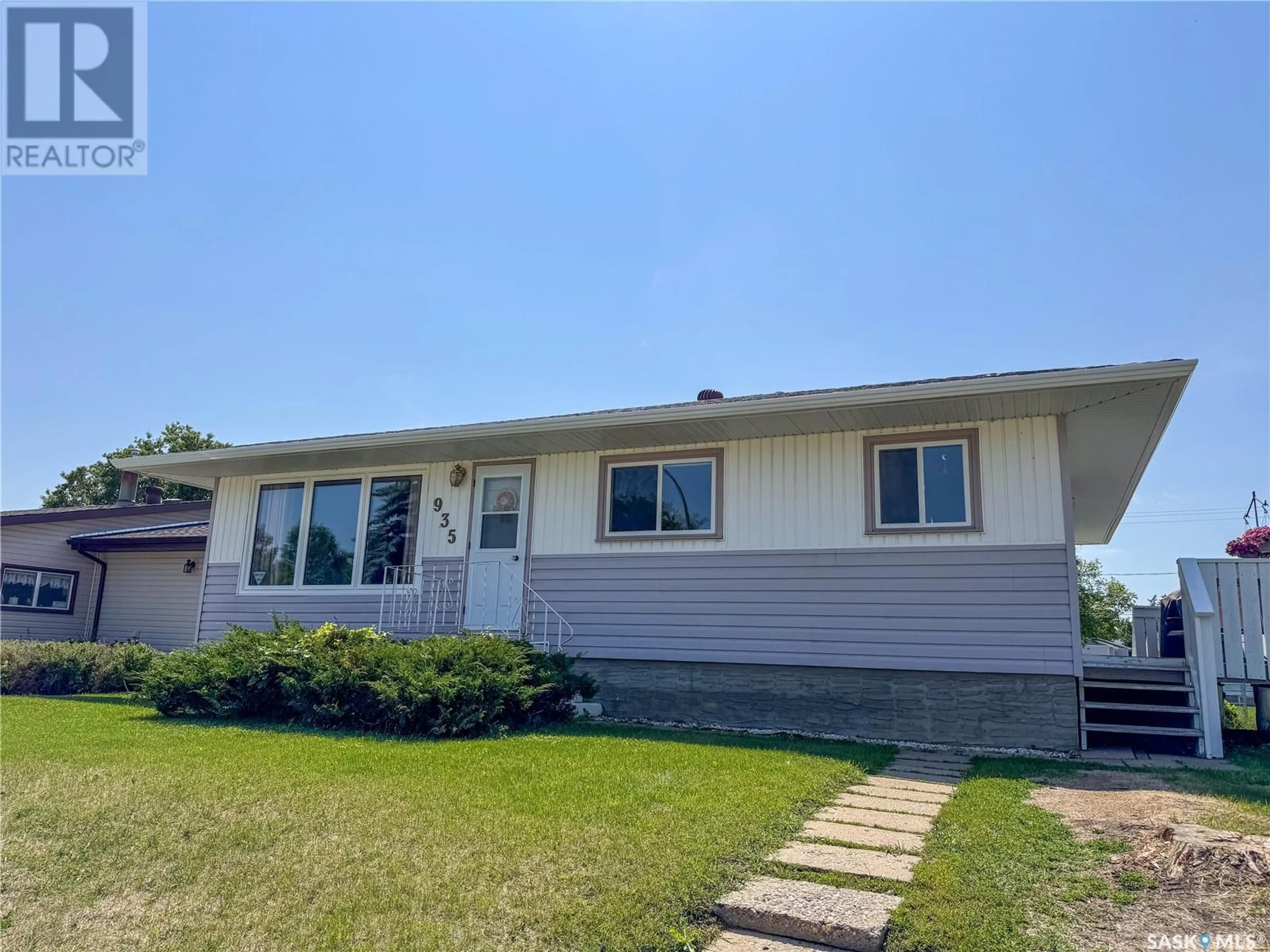 Home with vinyl exterior material, street for 935 1ST STREET, Prince Albert Saskatchewan S6V0C5