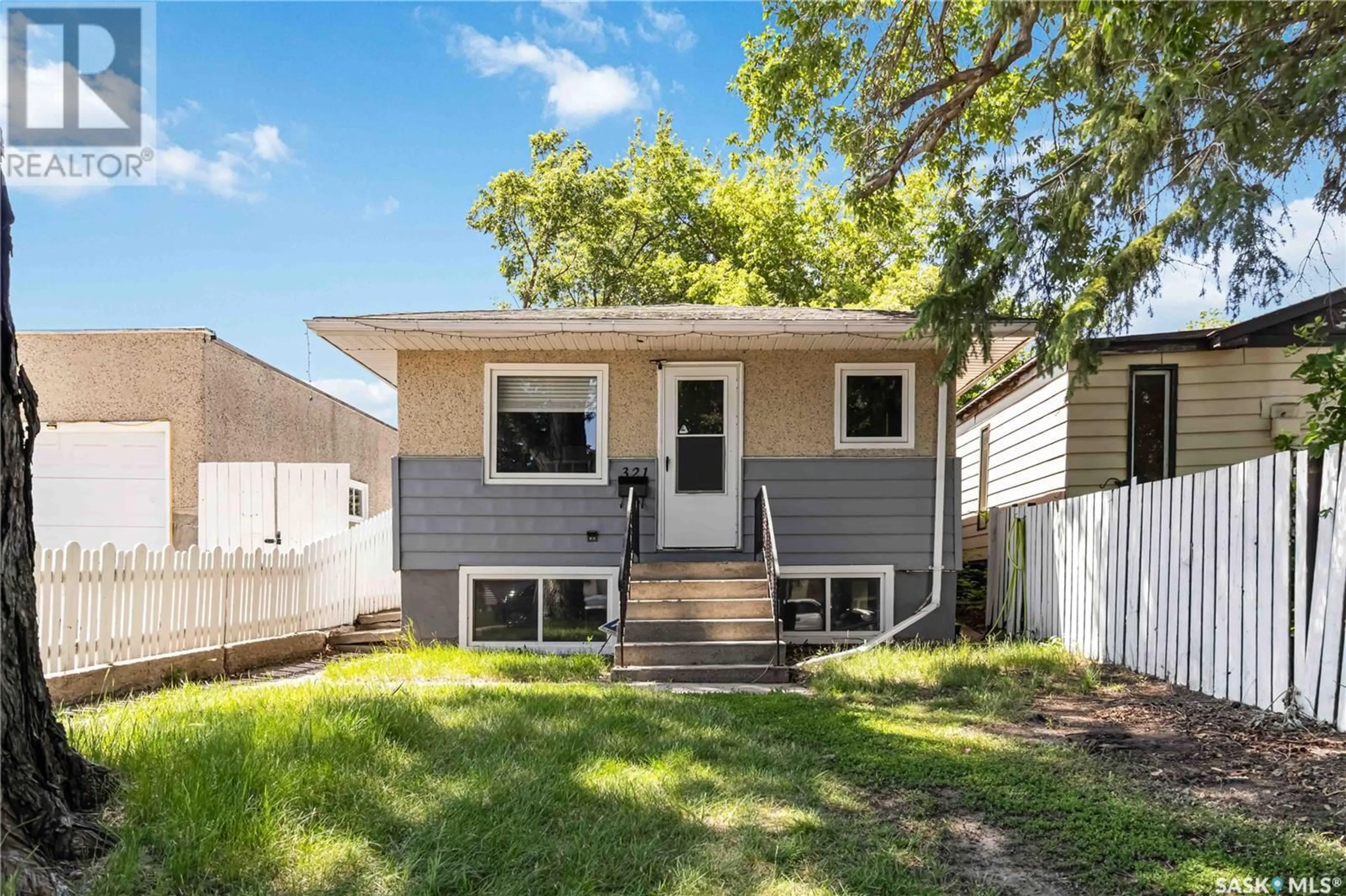 Home with vinyl exterior material, street for 321 WITNEY AVENUE, Saskatoon Saskatchewan S7M3K4