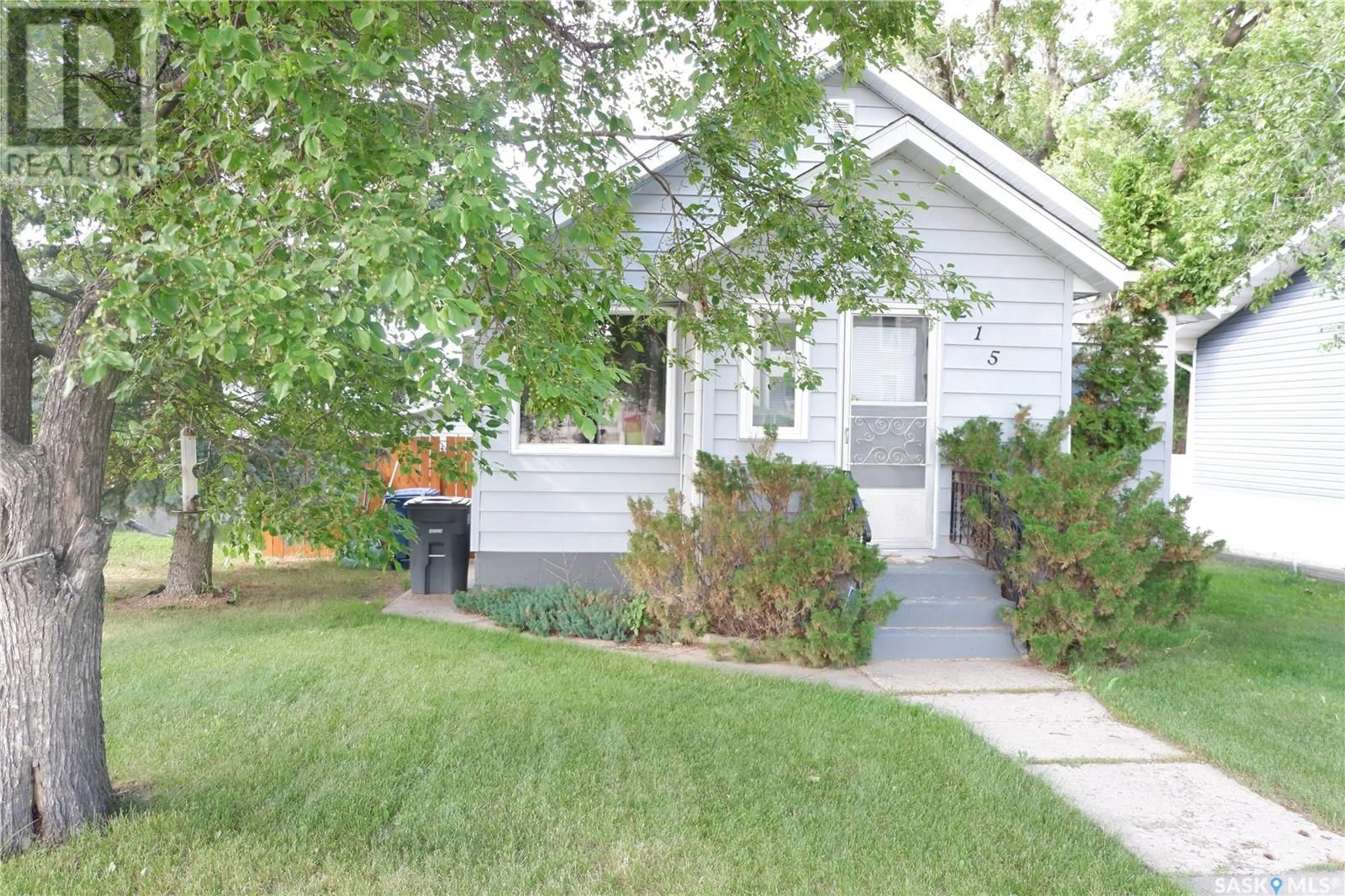 Home with vinyl exterior material, street for 215 4TH AVENUE, Assiniboia Saskatchewan S0H0B0