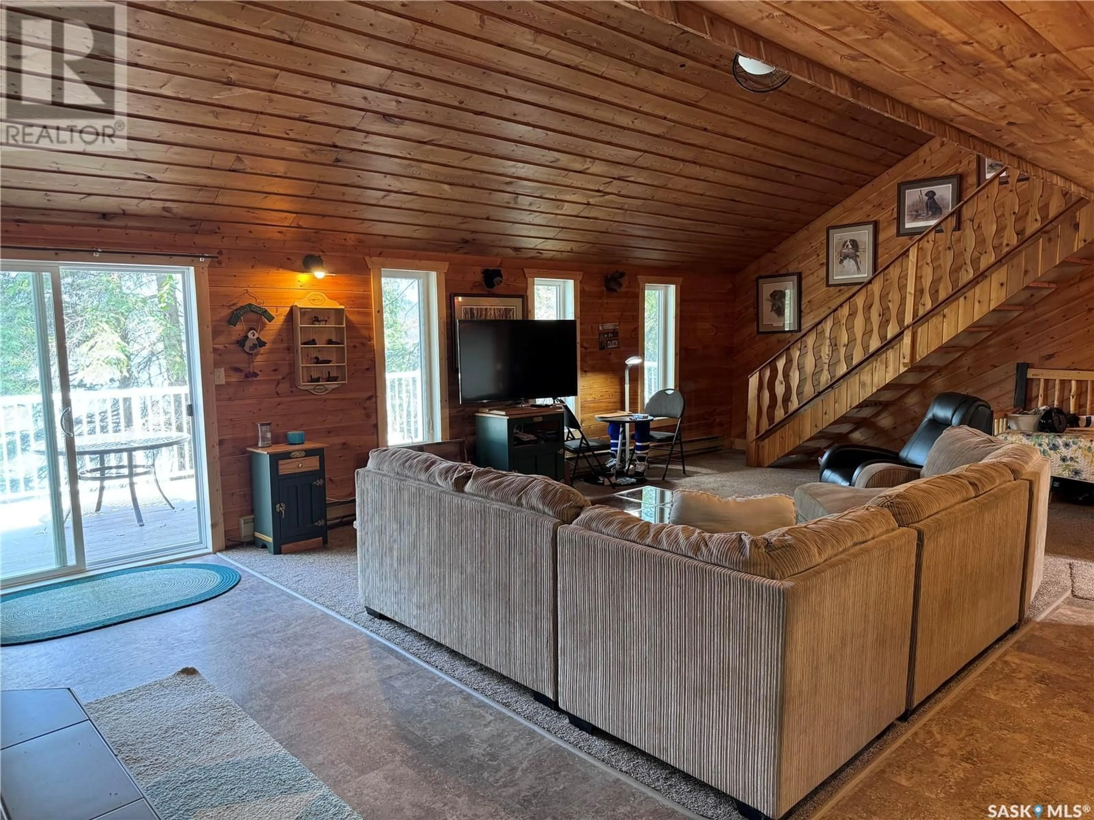 Living room with furniture, wood/laminate floor for 334 LINDSEY LANE, Barrier Valley Rm No. 397 Saskatchewan S0E0B0