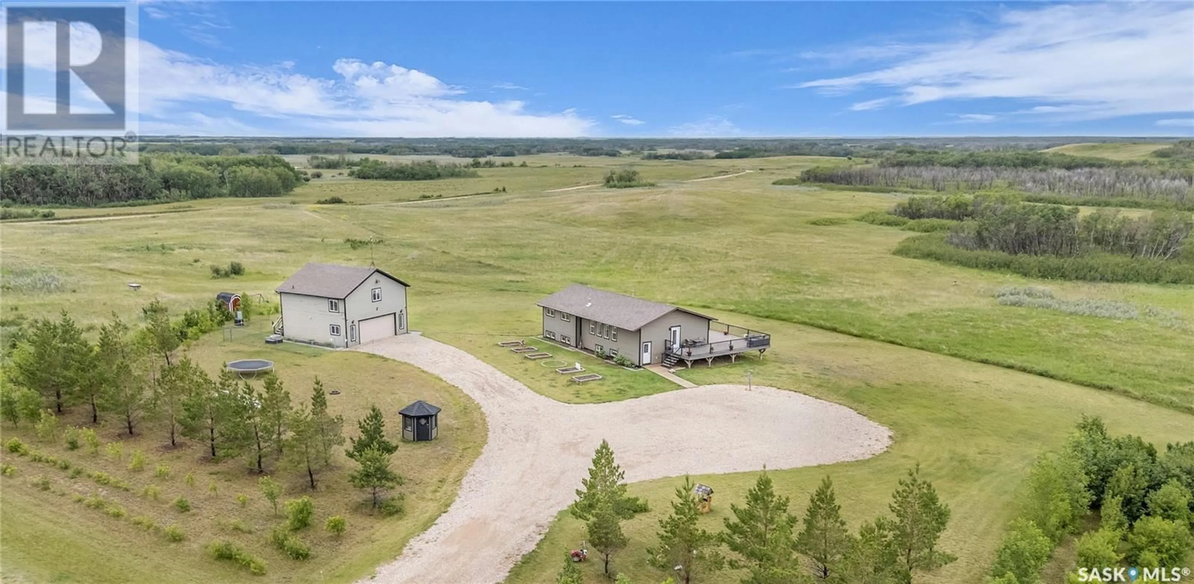 A pic from outside/outdoor area/front of a property/back of a property/a pic from drone, mountain view for MAIN ACREAGE, Biggar Rm No. 347 Saskatchewan S0K0M0