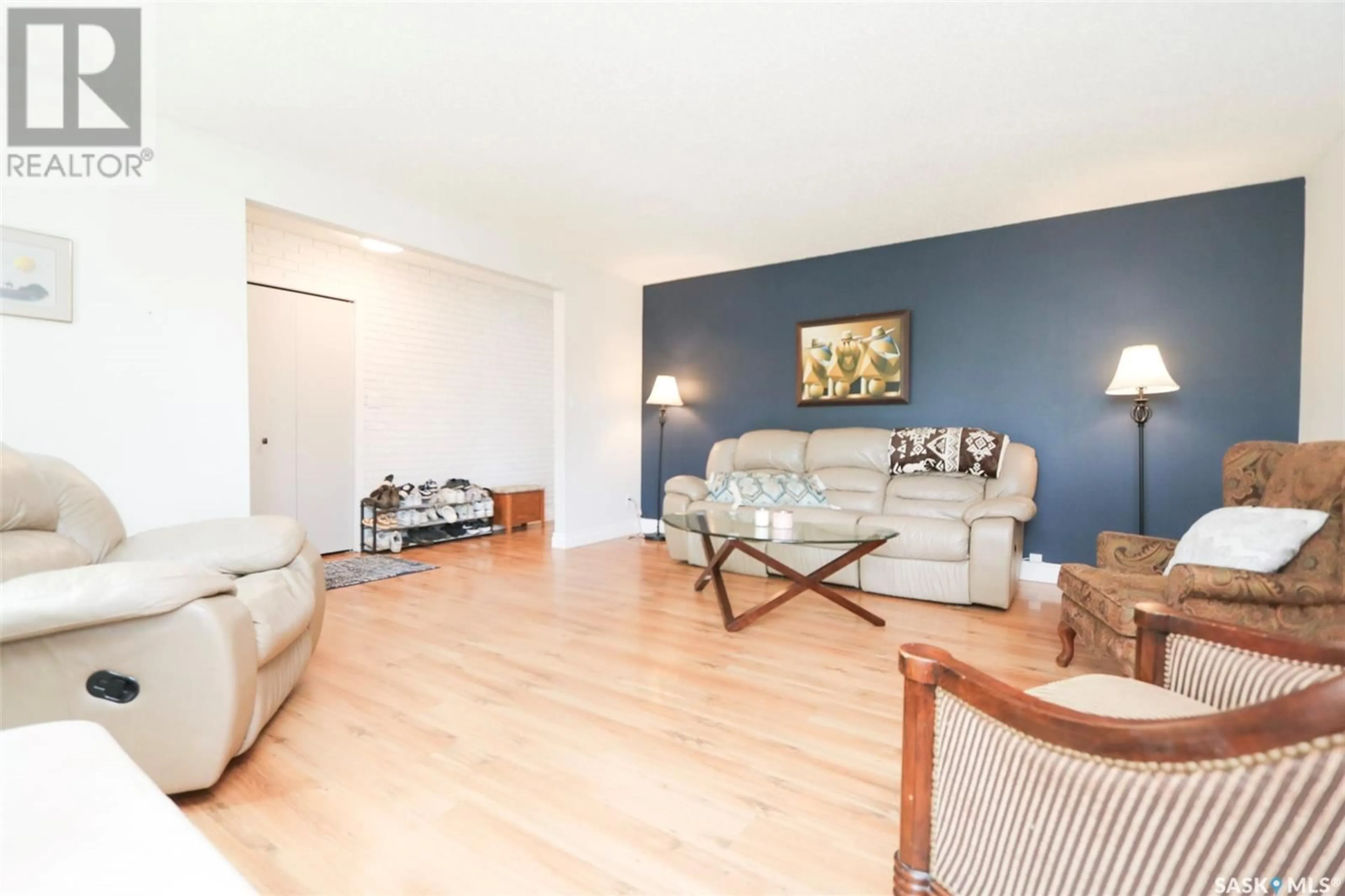 Living room with furniture, wood/laminate floor for 228 SUNSET DRIVE, Yorkton Saskatchewan S3N3R3