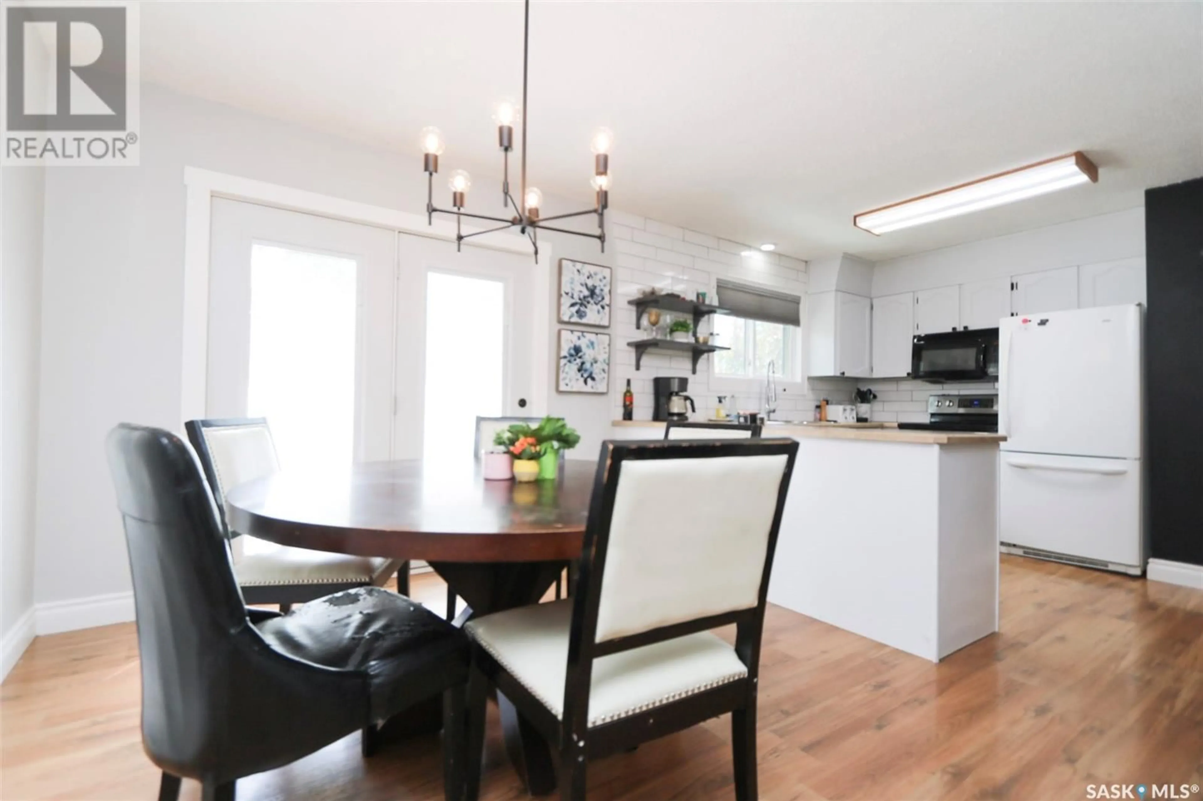 Open concept kitchen, wood/laminate floor for 228 SUNSET DRIVE, Yorkton Saskatchewan S3N3R3