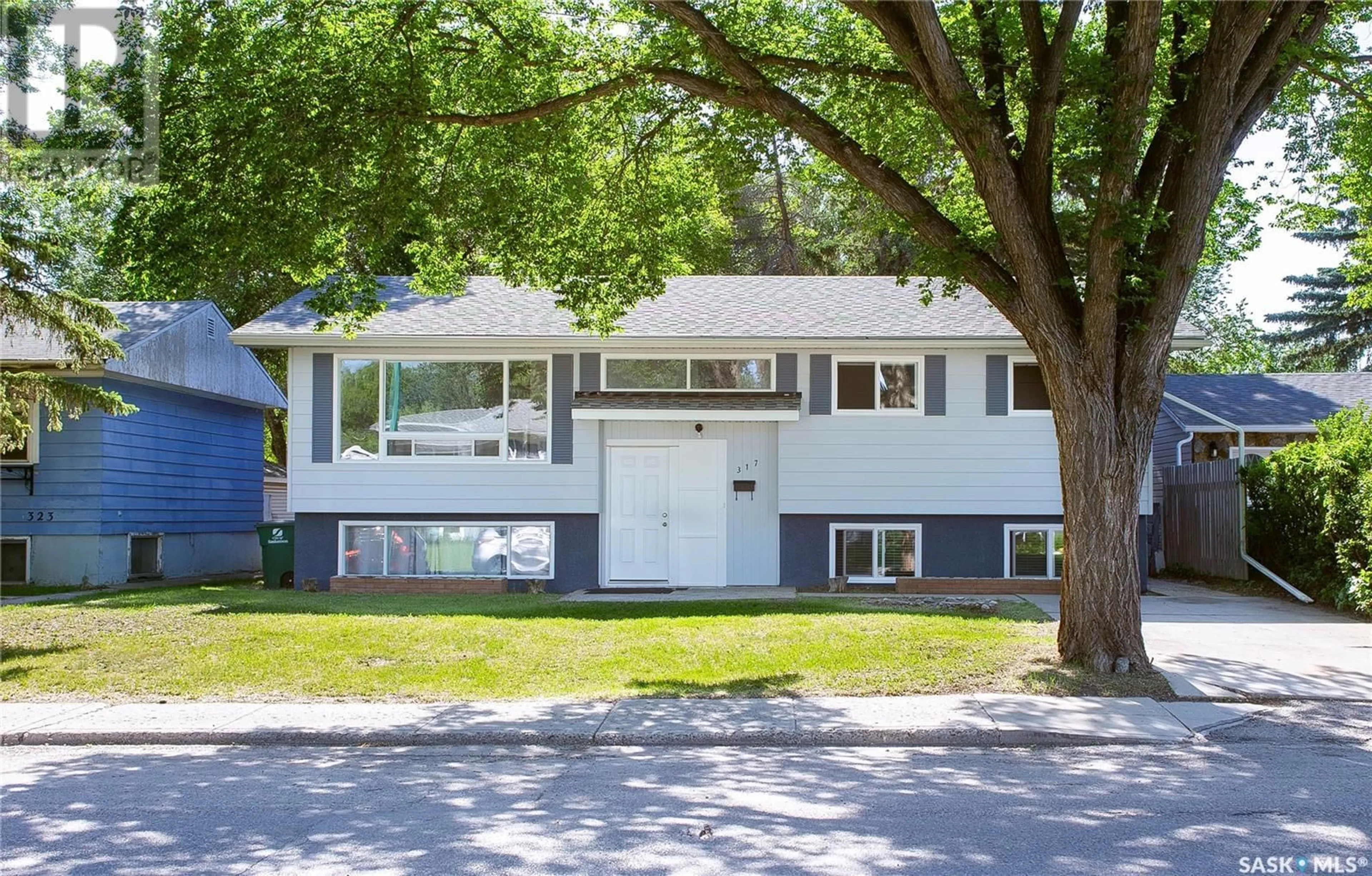 Home with vinyl exterior material, street for 317 WINNIPEG AVENUE, Saskatoon Saskatchewan S7M3M3