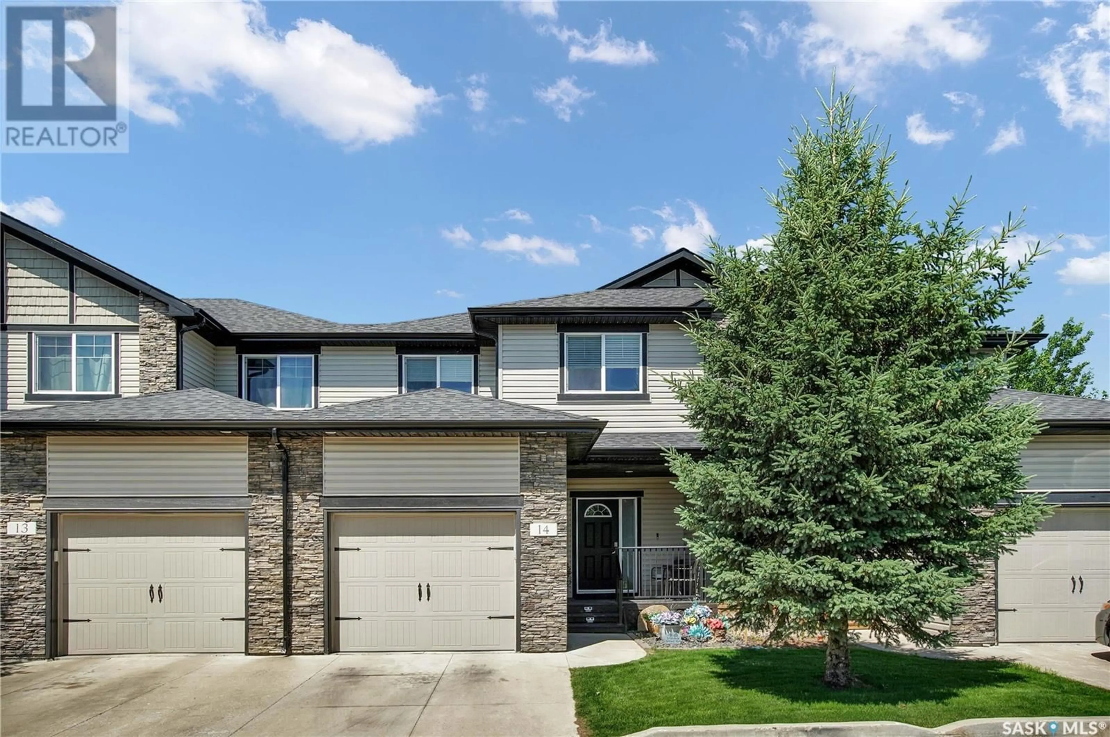 Home with brick exterior material, street for 215 - 14 HAMPTON GREEN, Saskatoon Saskatchewan S7R0G7