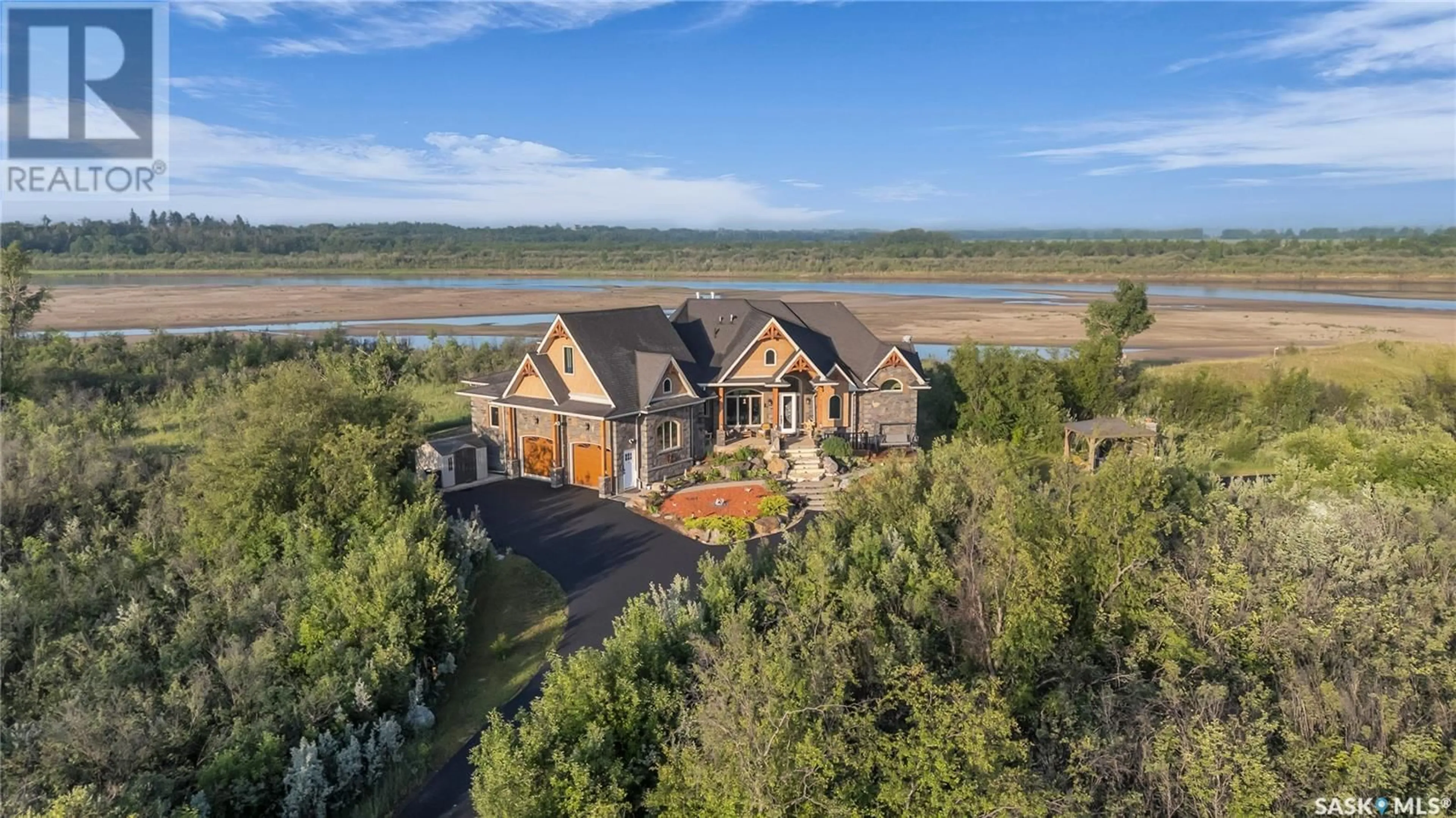 A pic from outside/outdoor area/front of a property/back of a property/a pic from drone, water/lake/river/ocean view for DURETTE RIVERFRONT ACREAGE, Corman Park Rm No. 344 Saskatchewan S7K3J6