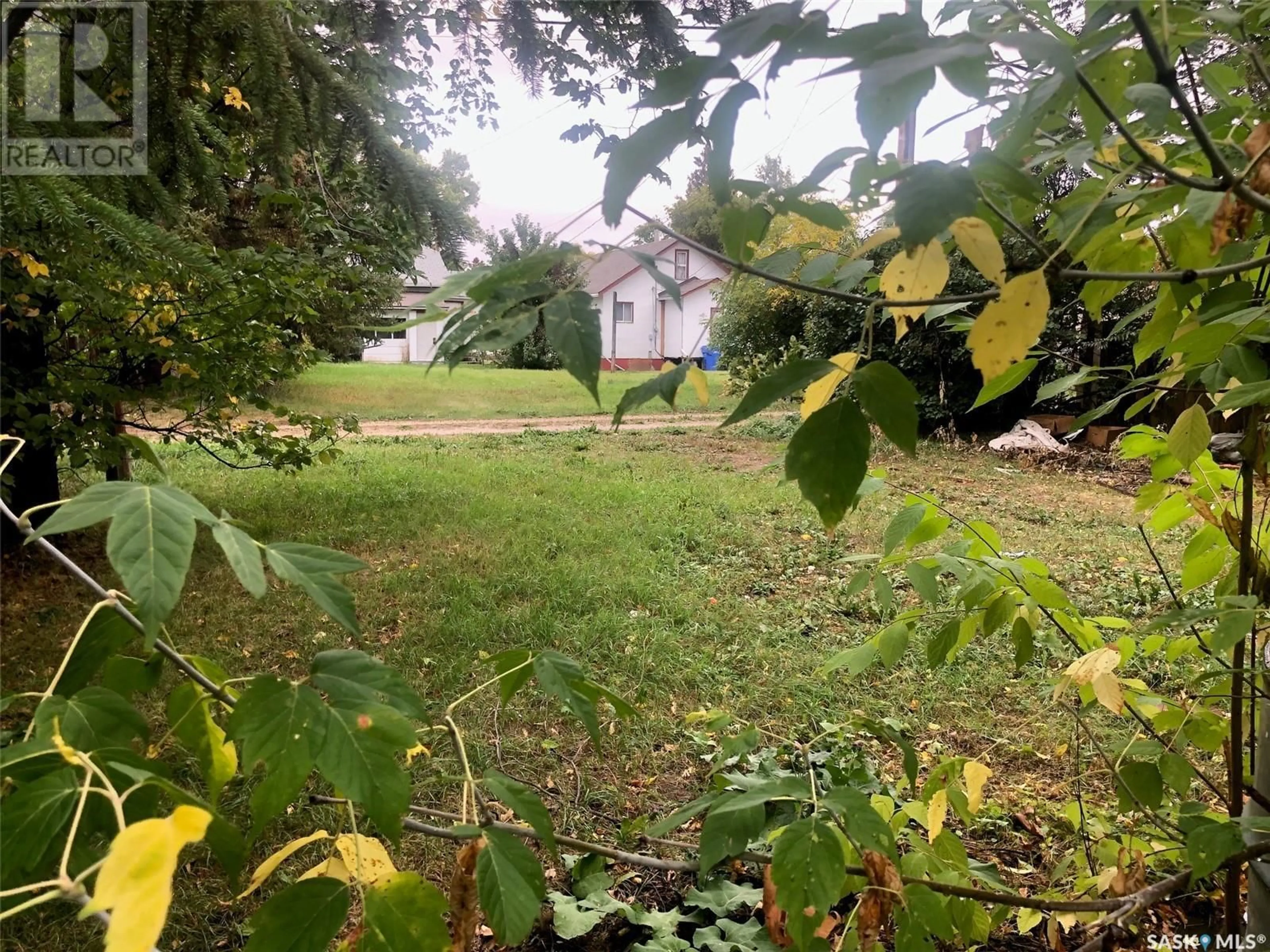 A pic from outside/outdoor area/front of a property/back of a property/a pic from drone, forest/trees view for 127 HARVEY STREET, Kamsack Saskatchewan S0A1S0