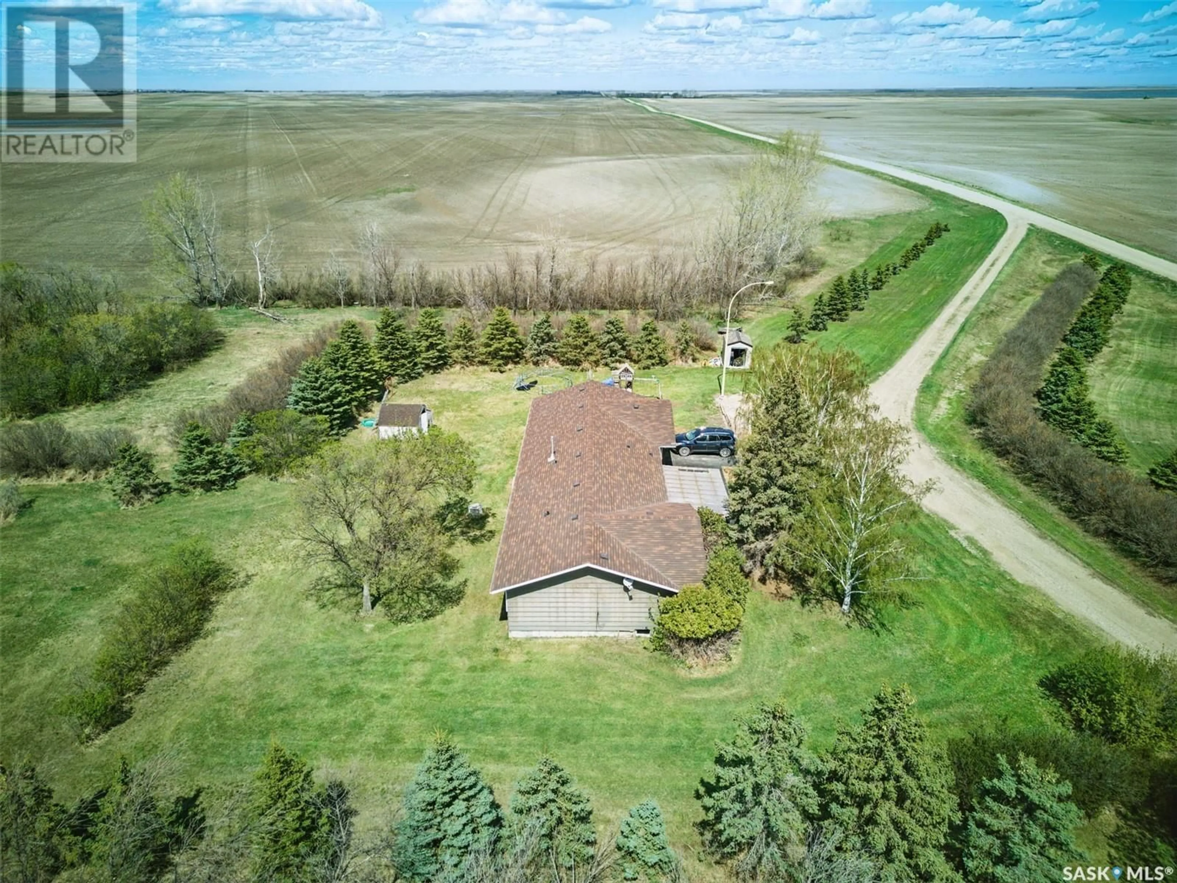 A pic from outside/outdoor area/front of a property/back of a property/a pic from drone, water/lake/river/ocean view for THONER ACREAGE, Morris Rm No. 312 Saskatchewan S0K4Y0