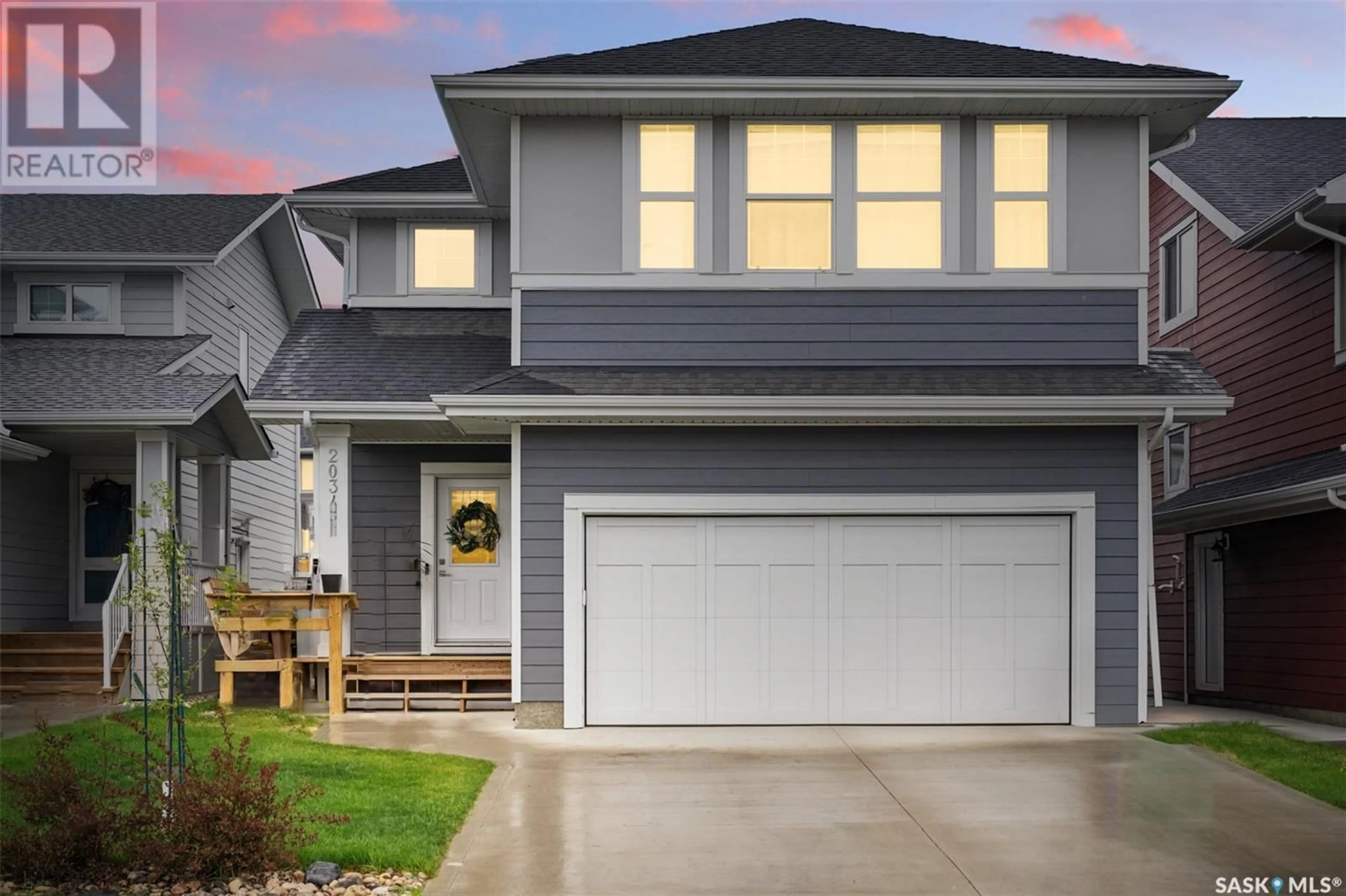 Home with vinyl exterior material, street for 2034 STILLING LANE, Saskatoon Saskatchewan S7V0X1