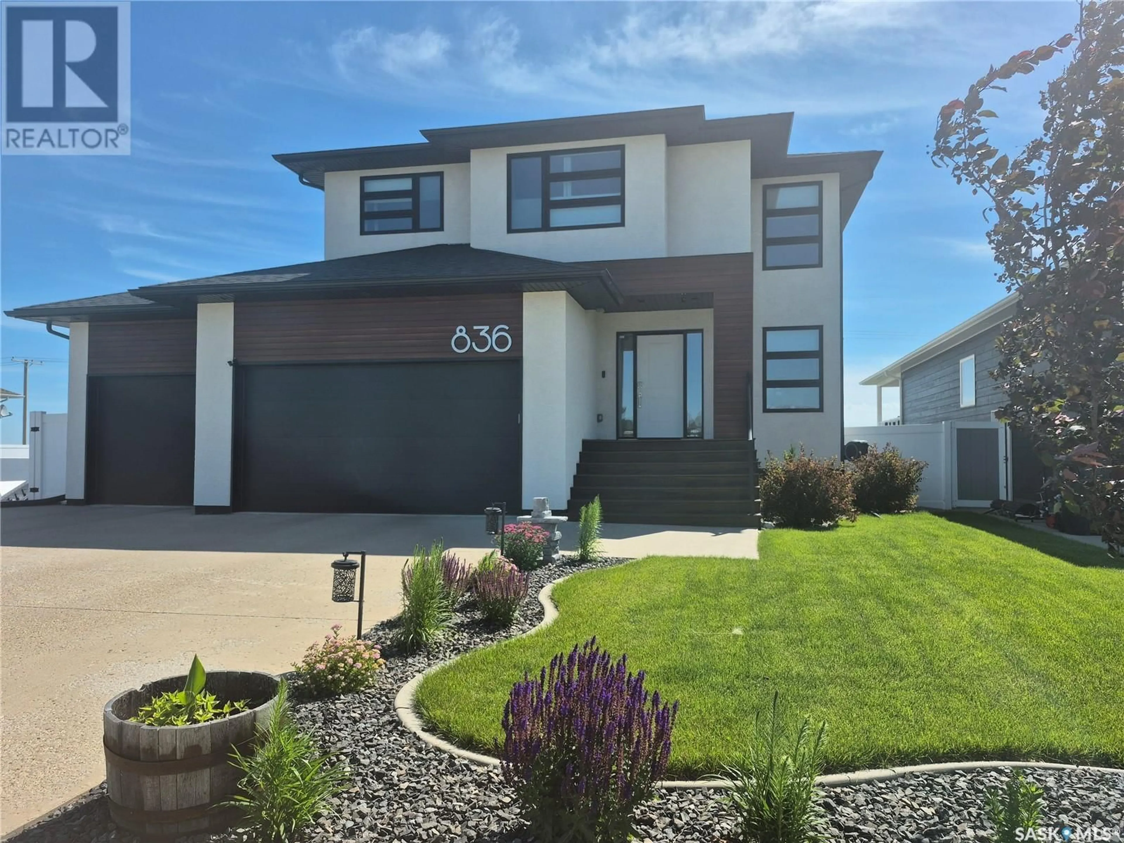 Home with vinyl exterior material, street for 836 MCTAGGART DRIVE, Weyburn Saskatchewan S4H3M6