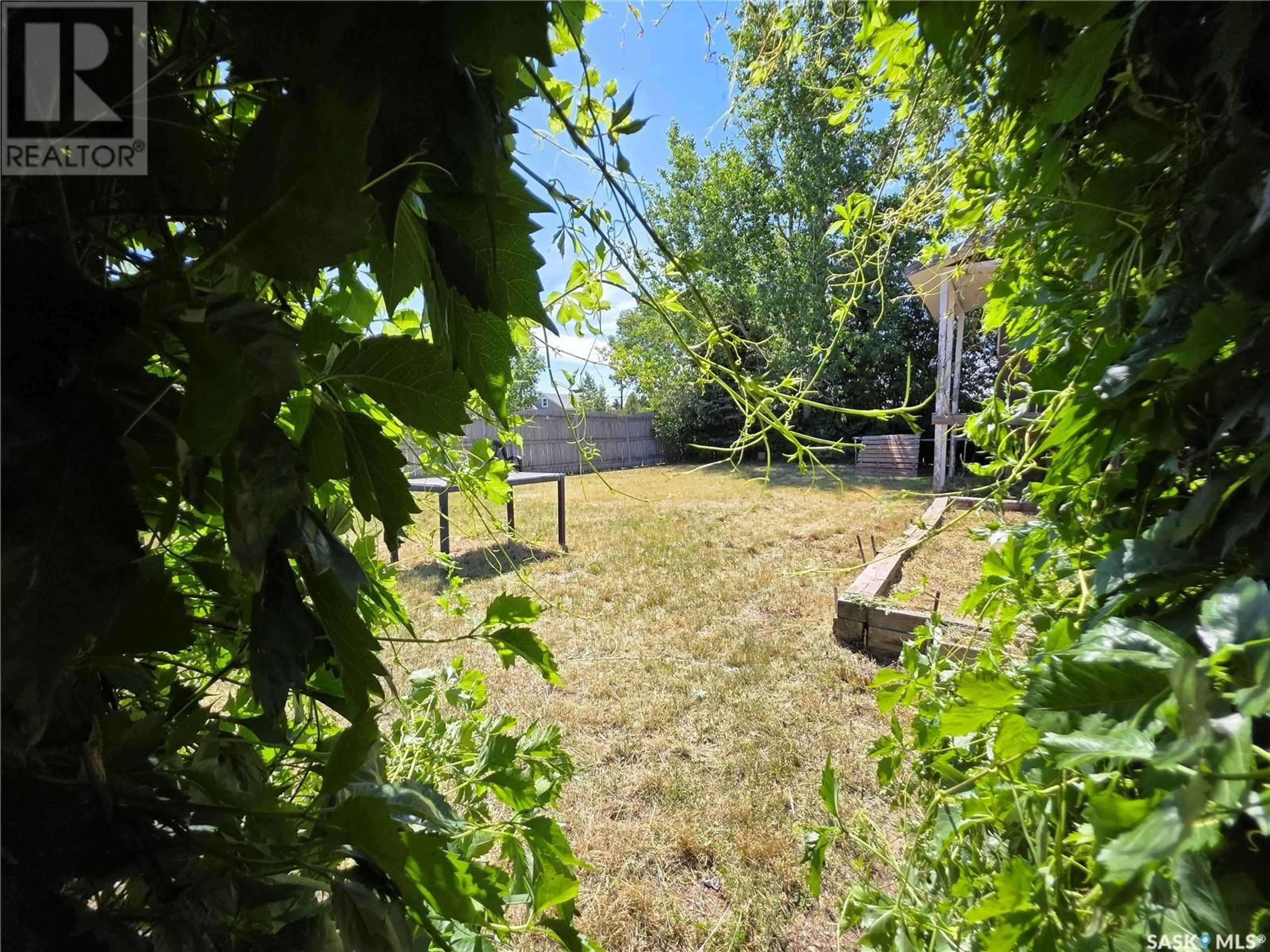 A pic from outside/outdoor area/front of a property/back of a property/a pic from drone, forest/trees view for 214 FLORA AVENUE, Swift Current Rm No. 137 Saskatchewan S0N2Y0