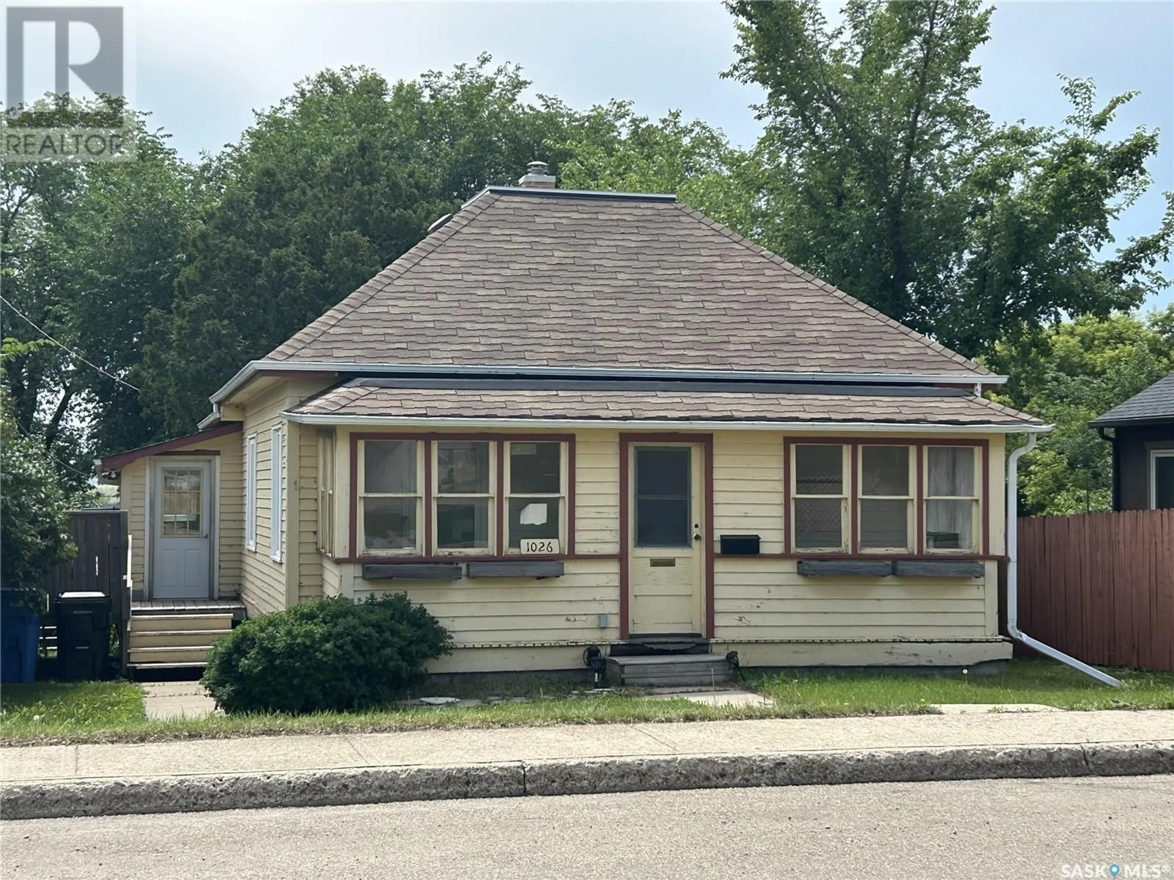 Home with vinyl exterior material, street for 1026 1ST STREET, Estevan Saskatchewan S4A0G7