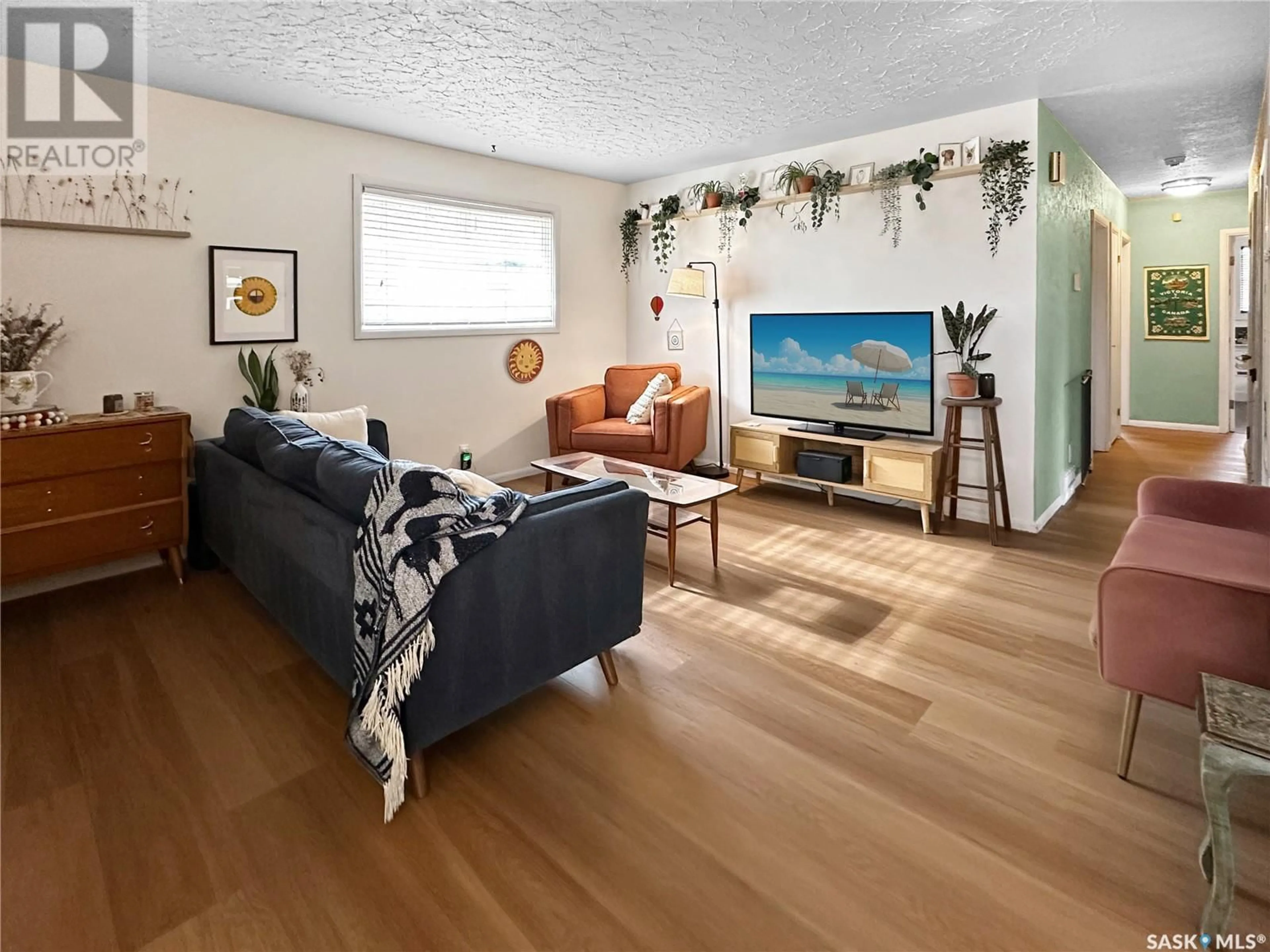 Living room with furniture, wood/laminate floor for 444 9TH STREET, Prince Albert Saskatchewan S6V0Y2