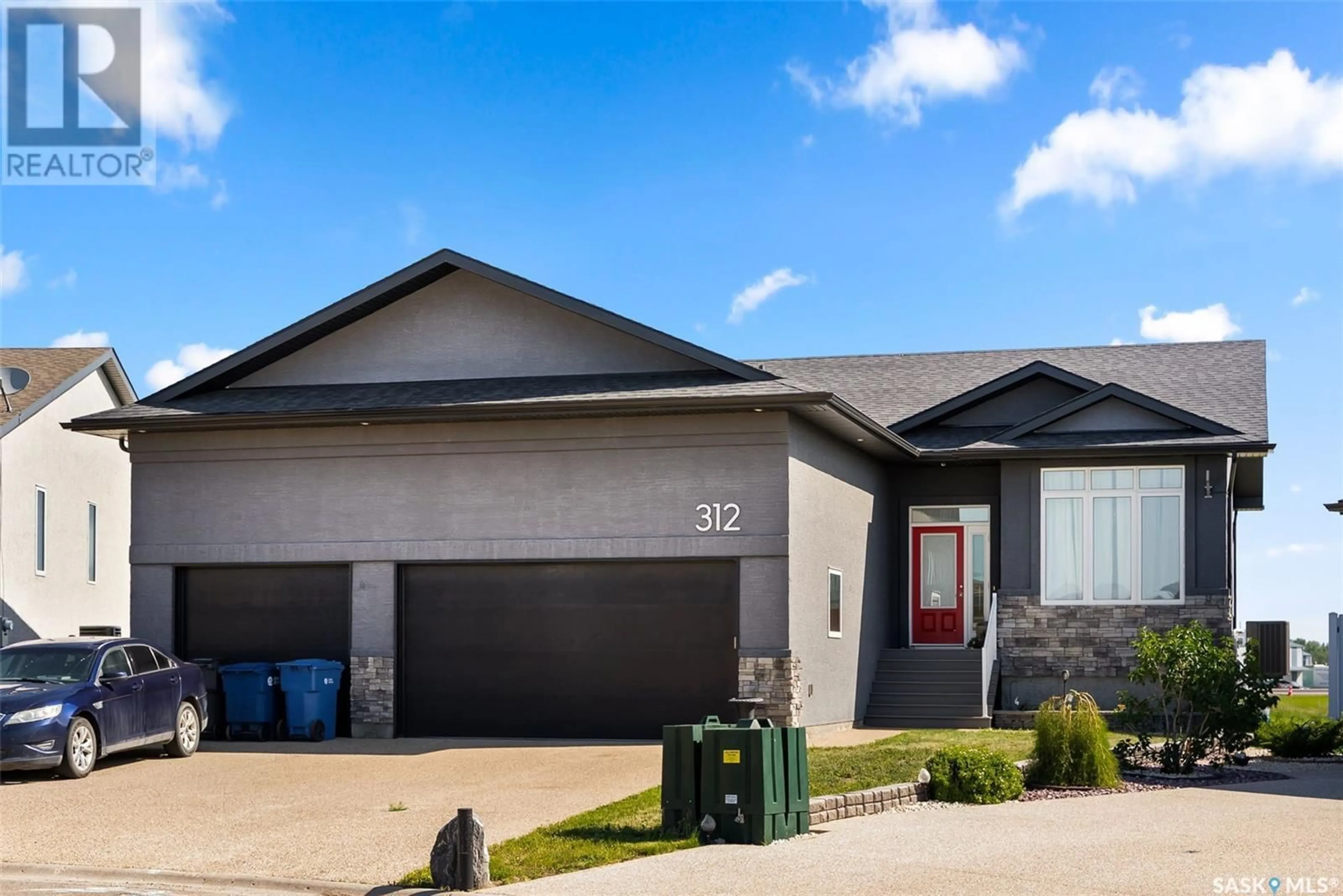 Home with vinyl exterior material, street for 312 PLAINS COURT, Pilot Butte Saskatchewan S0G3Z0