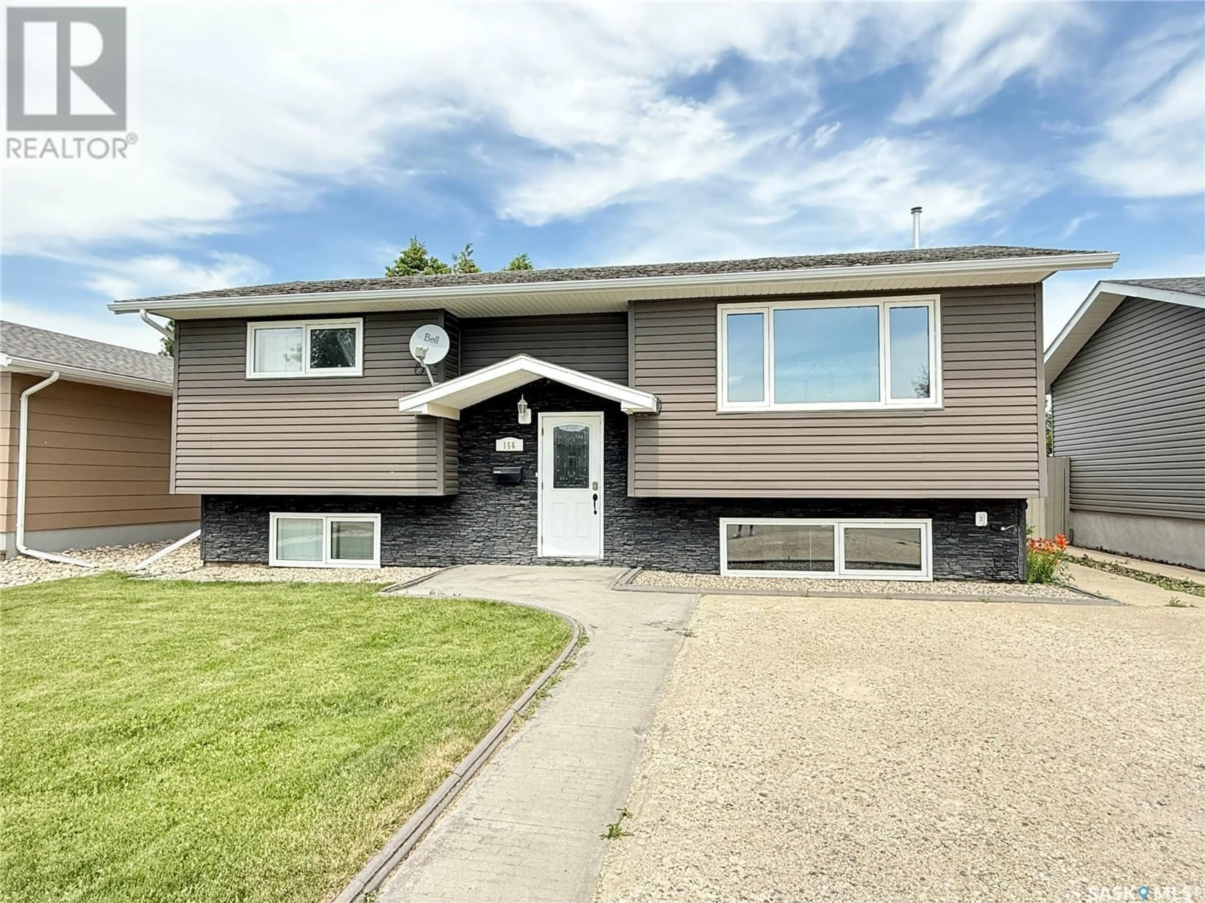 Home with vinyl exterior material, street for 156 MONTGOMERY CRESCENT, Weyburn Saskatchewan S4H2X7