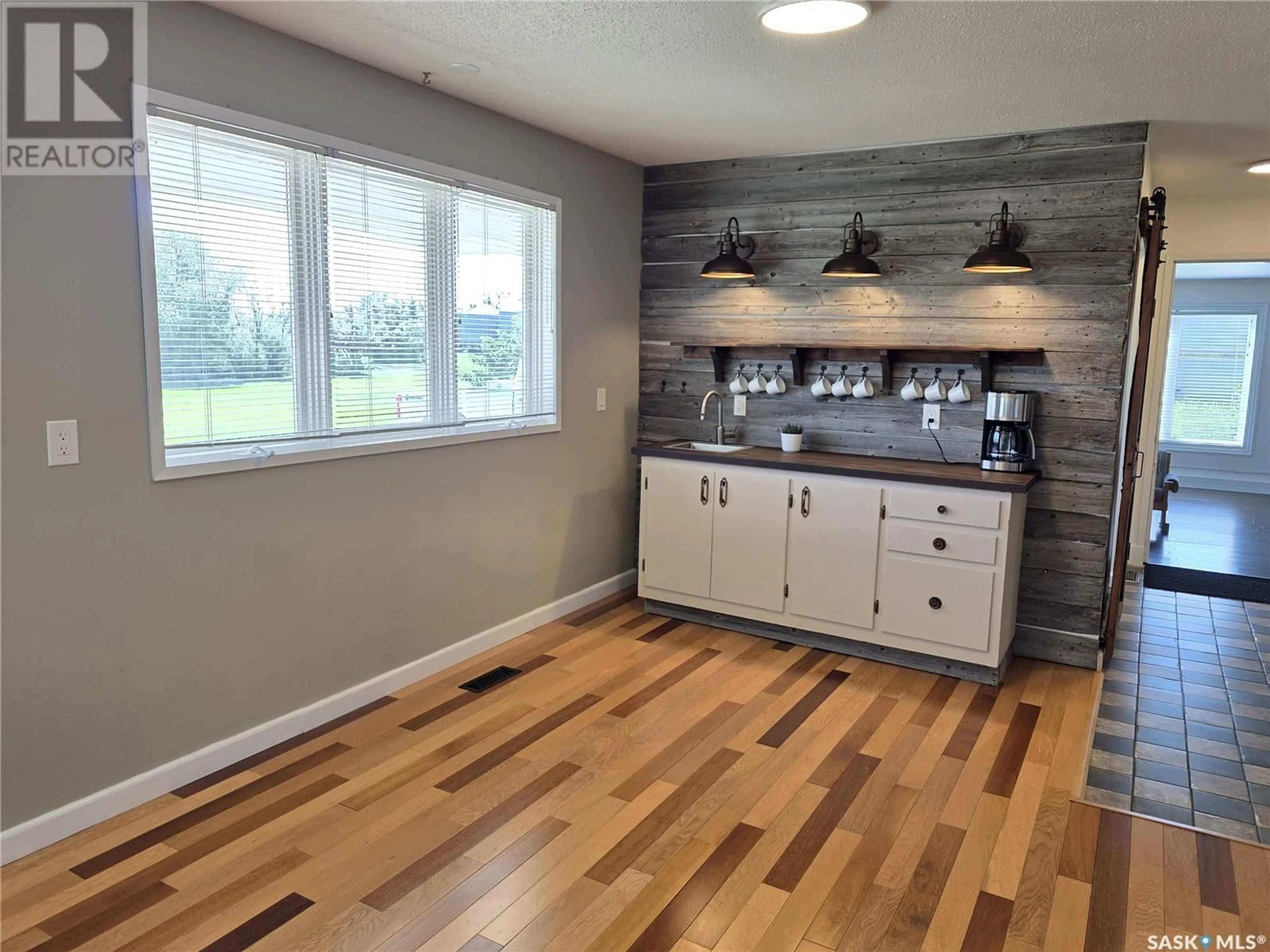 Open concept kitchen, wood/laminate floor for KENASTON ACREAGE, Mccraney Rm No. 282 Saskatchewan S0G2N0