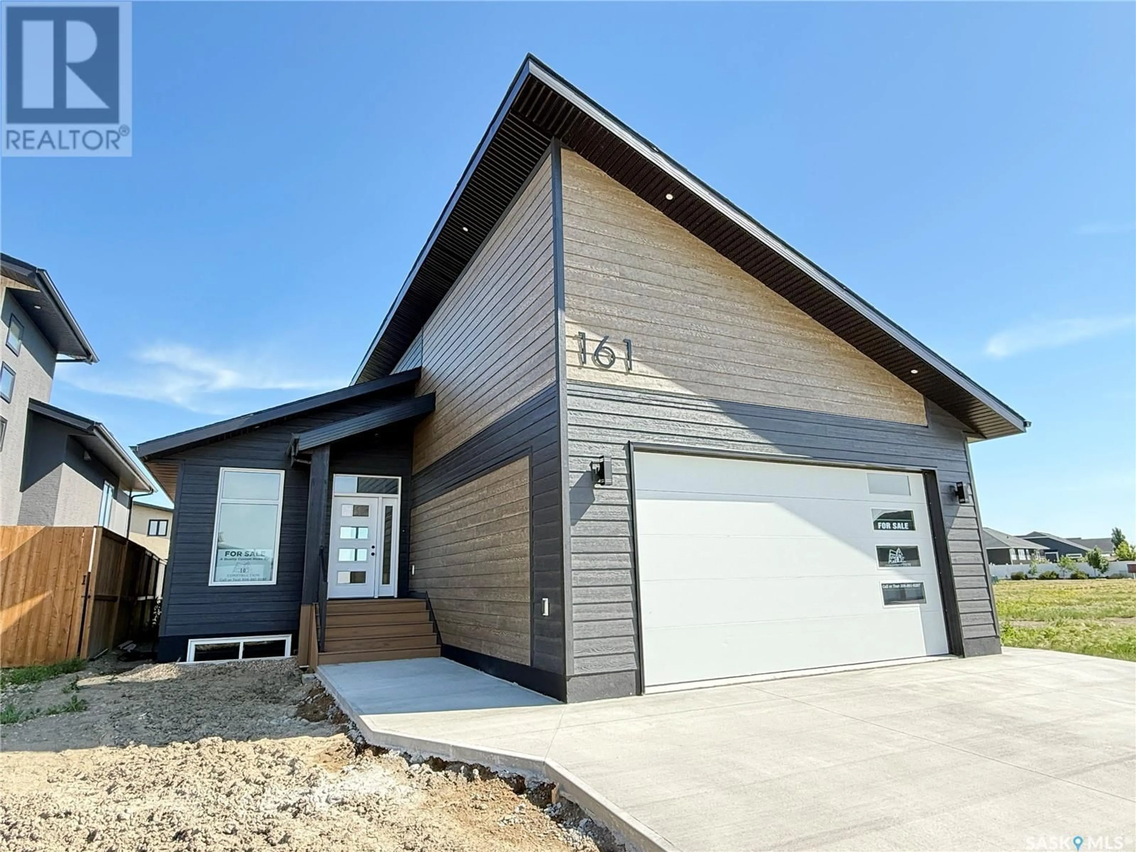 Home with vinyl exterior material, street for 161 DELAET DRIVE, Weyburn Saskatchewan S4H3B9