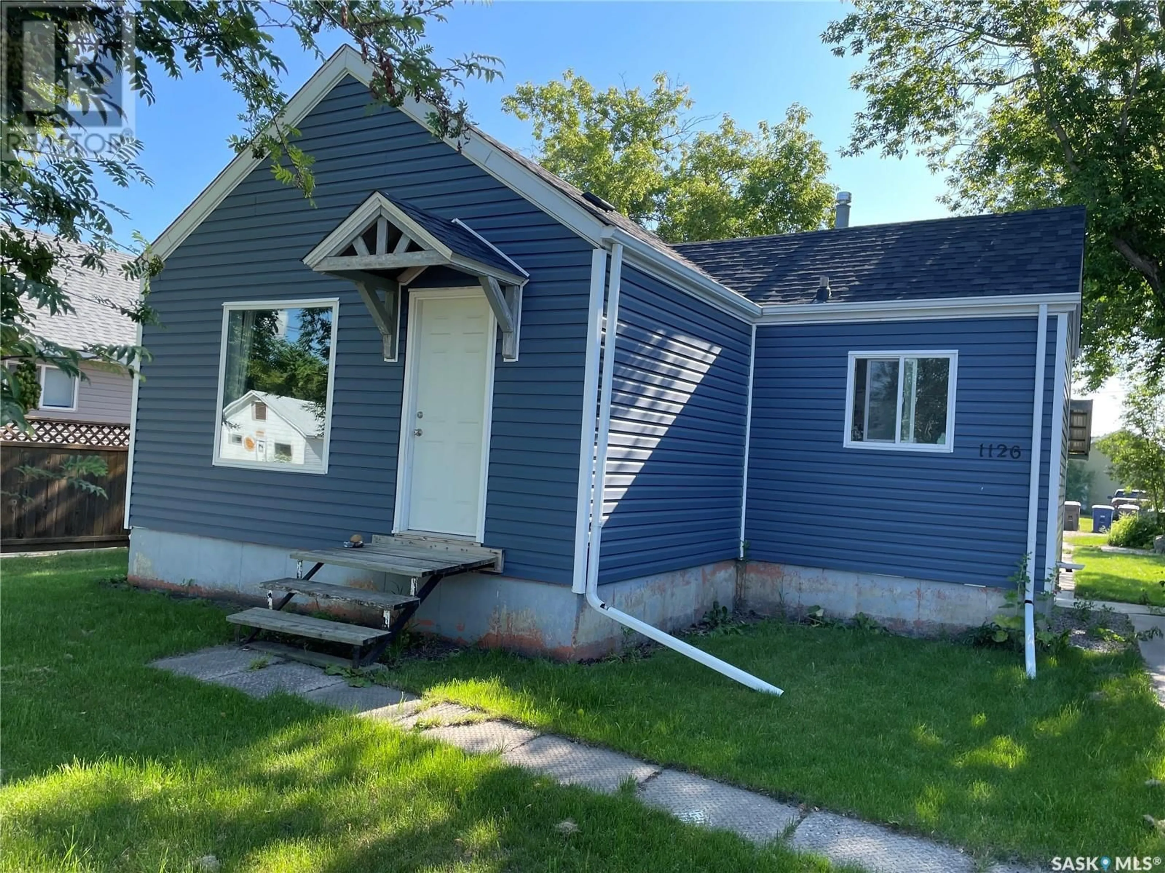 Home with vinyl exterior material, street for 1126 1ST STREET, Carrot River Saskatchewan S0E0L0