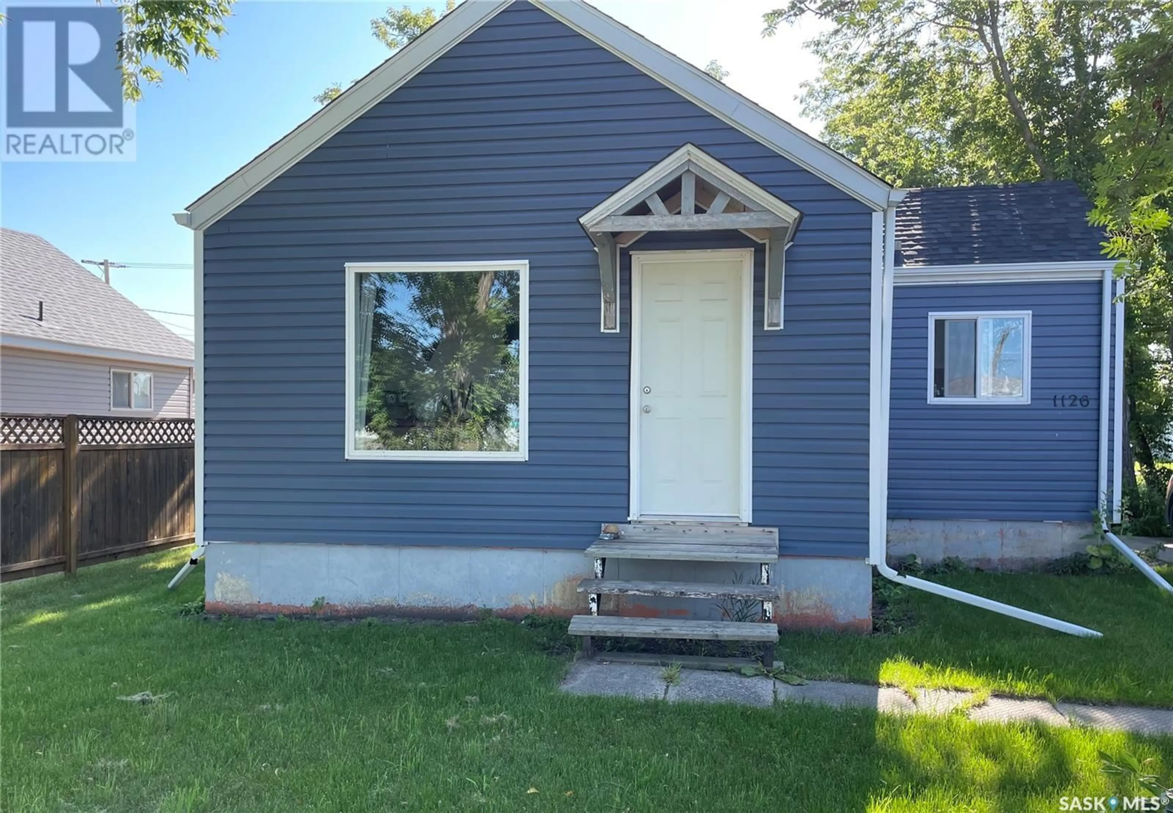 Home with vinyl exterior material, street for 1126 1ST STREET, Carrot River Saskatchewan S0E0L0