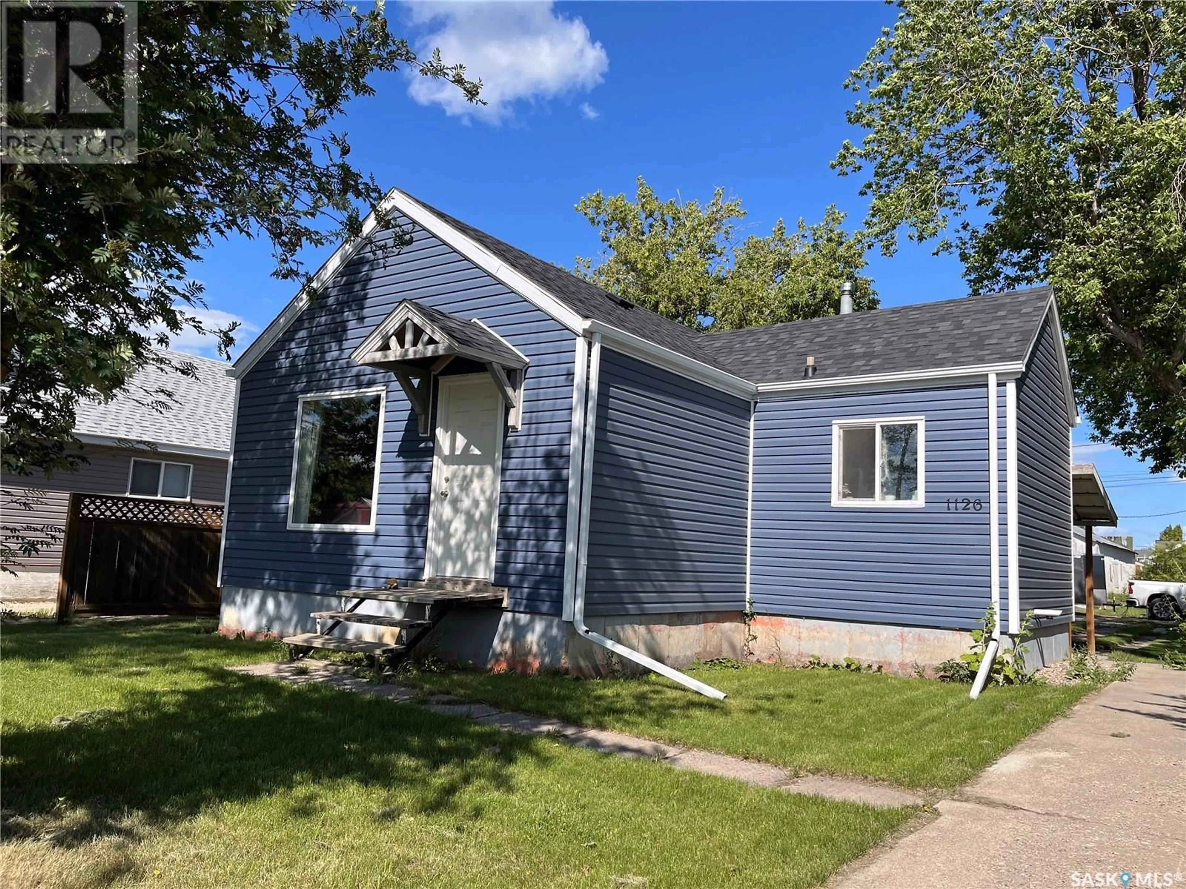 Home with vinyl exterior material, street for 1126 1ST STREET, Carrot River Saskatchewan S0E0L0