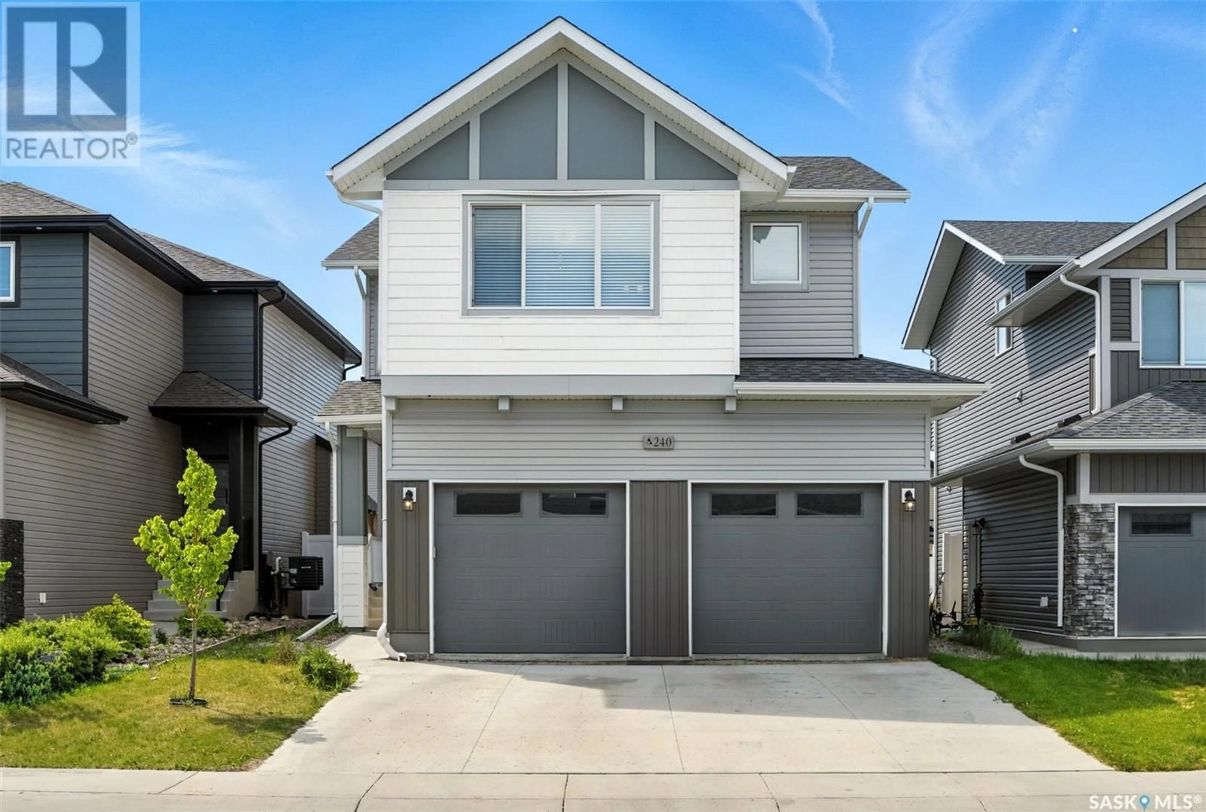 Home with vinyl exterior material, street for 240 BARRETT STREET, Saskatoon Saskatchewan S7W1C7