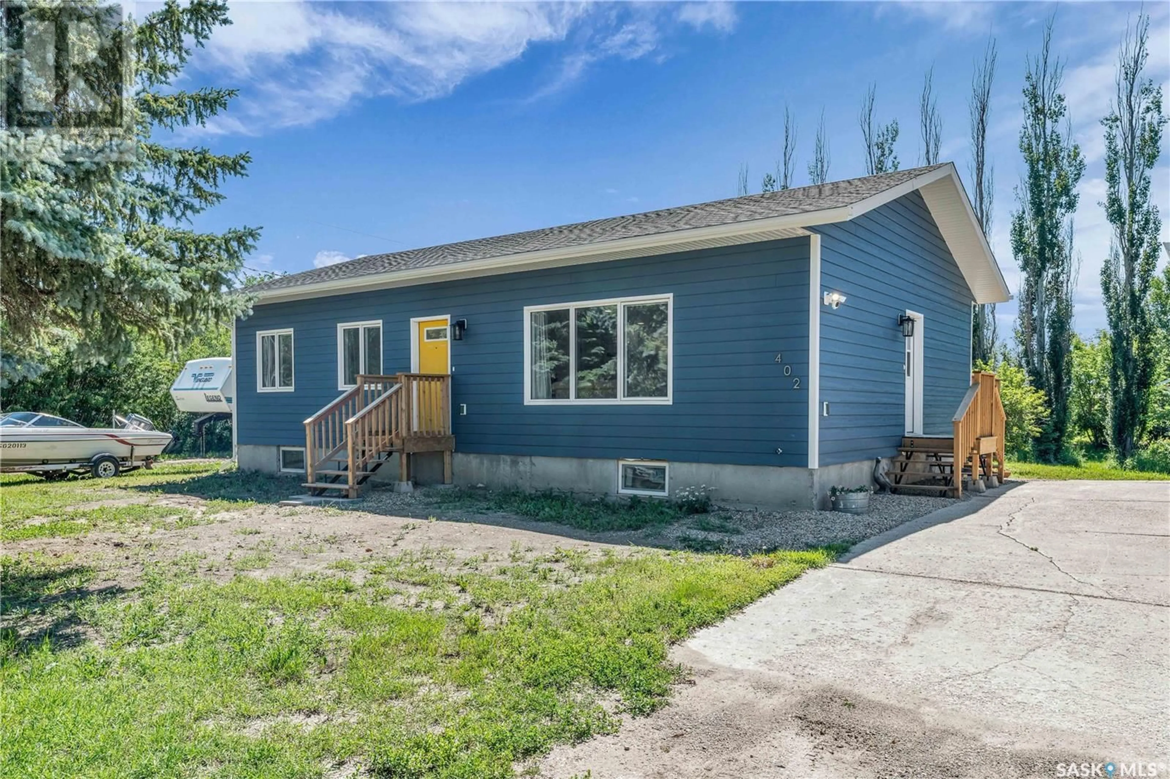 Home with vinyl exterior material, street for 402 ALEXANDER STREET, Radisson Saskatchewan S0K3L0