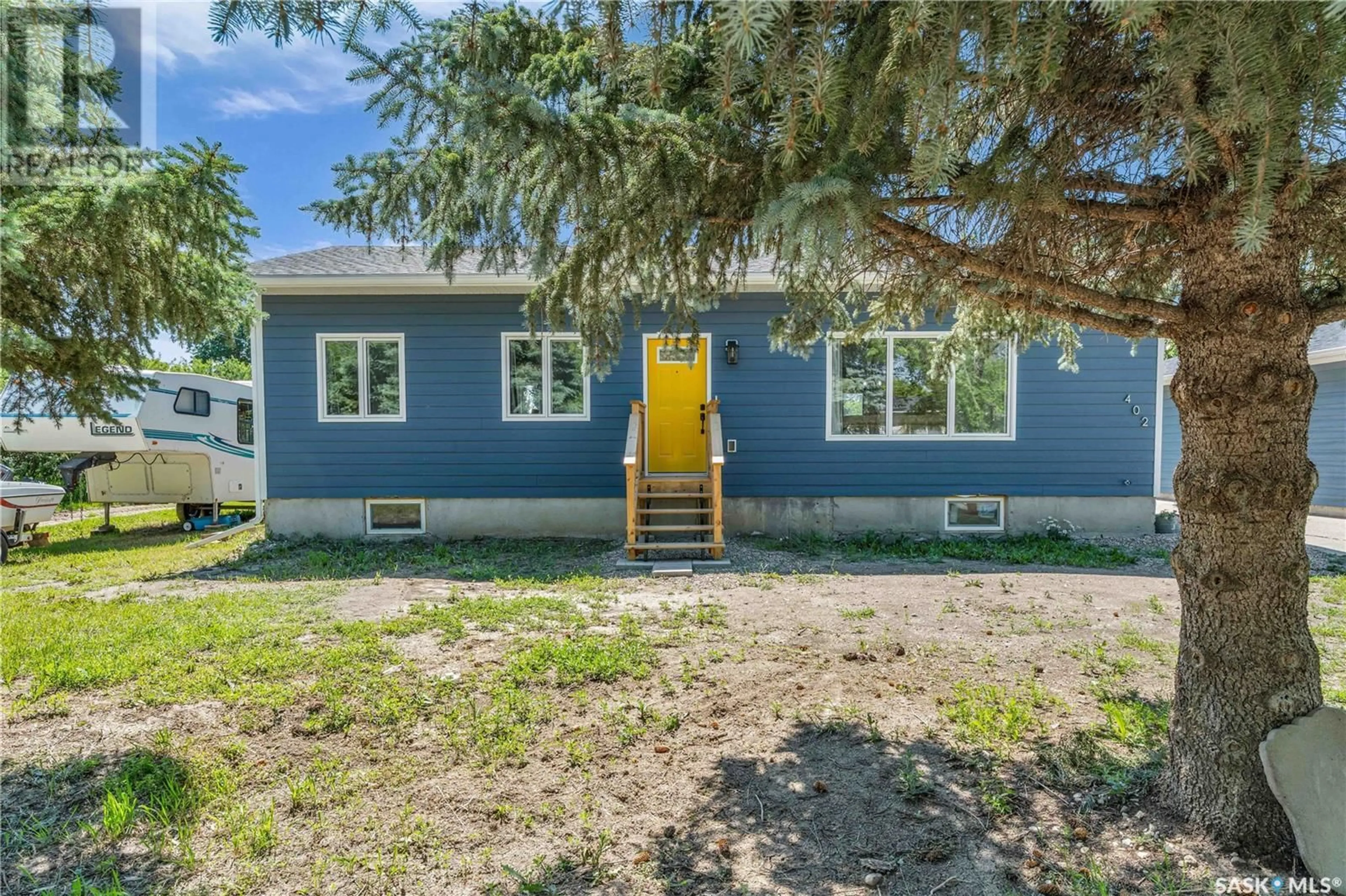 Home with vinyl exterior material, street for 402 ALEXANDER STREET, Radisson Saskatchewan S0K3L0
