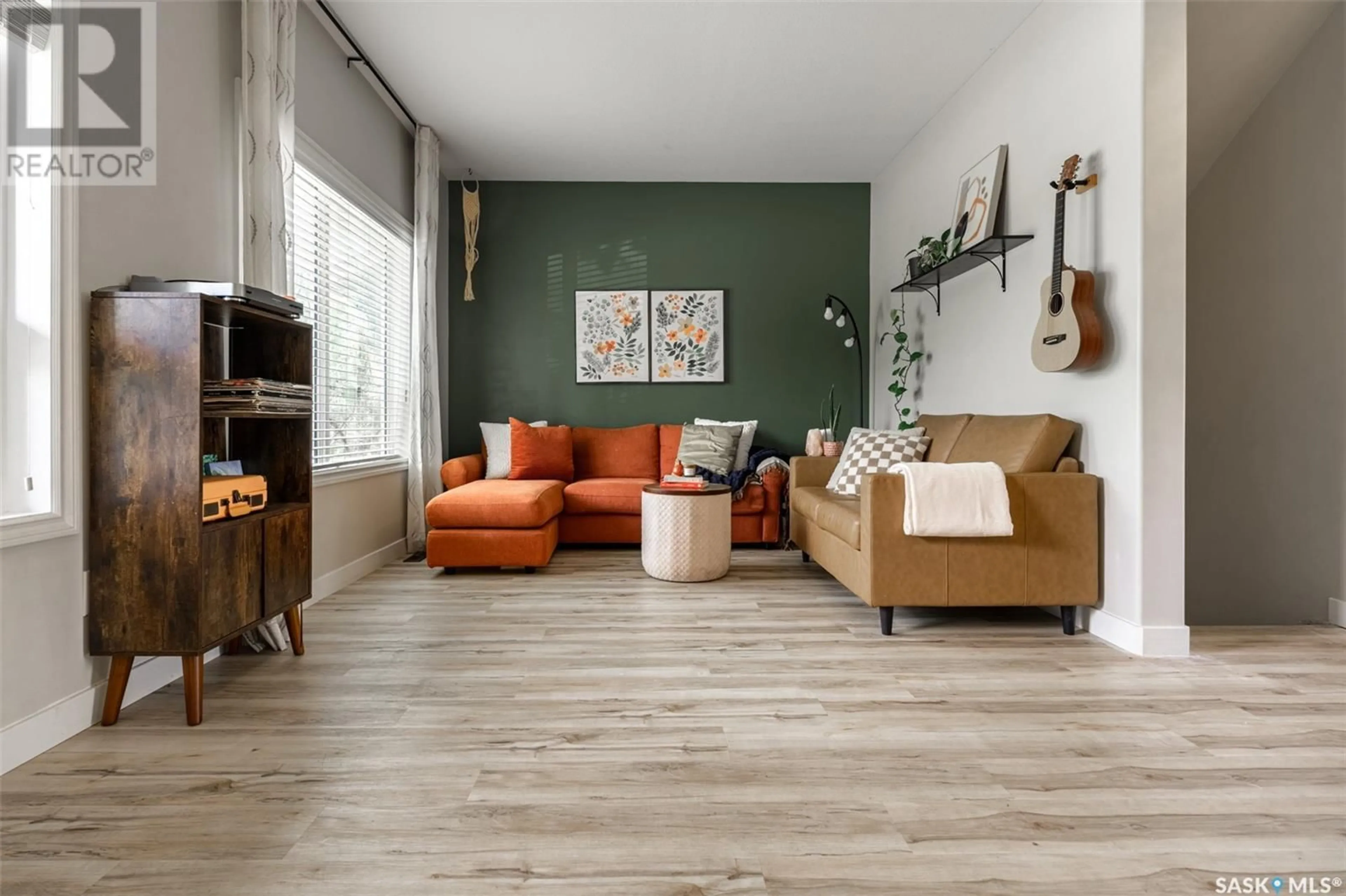 Living room with furniture, wood/laminate floor for 360 WILLOWGROVE LANE, Saskatoon Saskatchewan S7W0H7