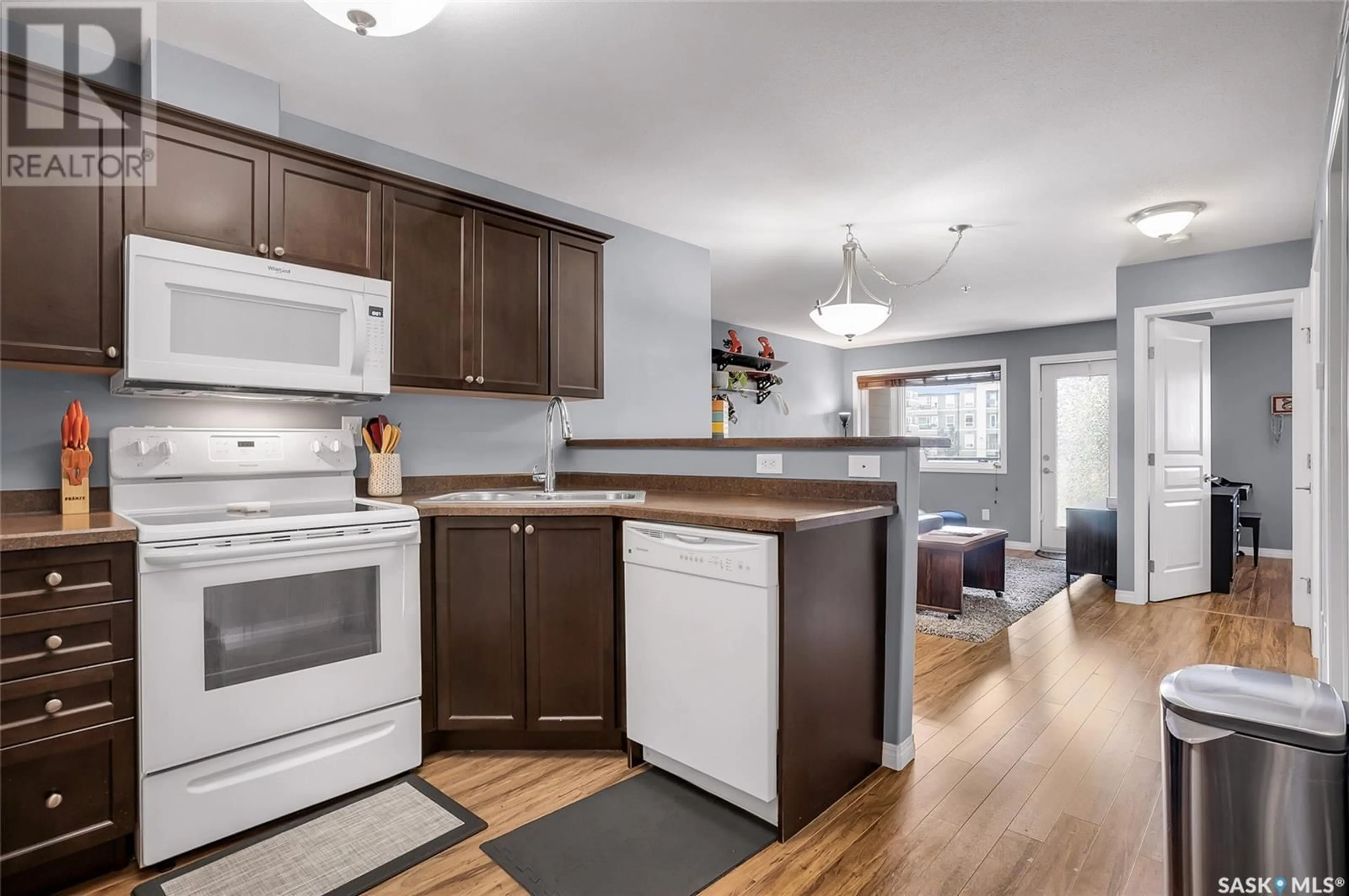 Open concept kitchen, wood/laminate floor for 6107 112 WILLIS CRESCENT, Saskatoon Saskatchewan S7T0N3