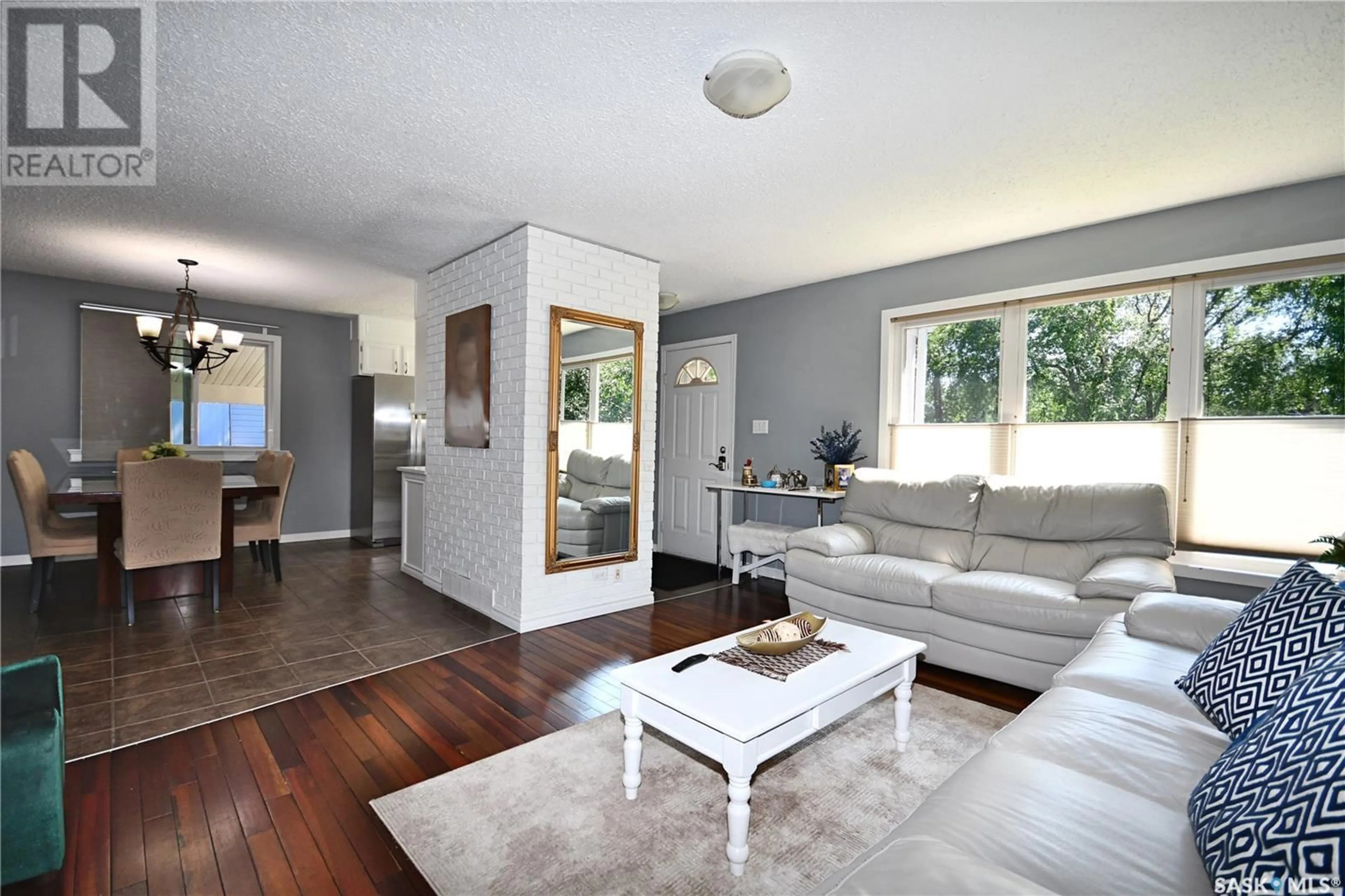 Living room with furniture, wood/laminate floor for 1438 2ND STREET, Prince Albert Saskatchewan S6V0H5