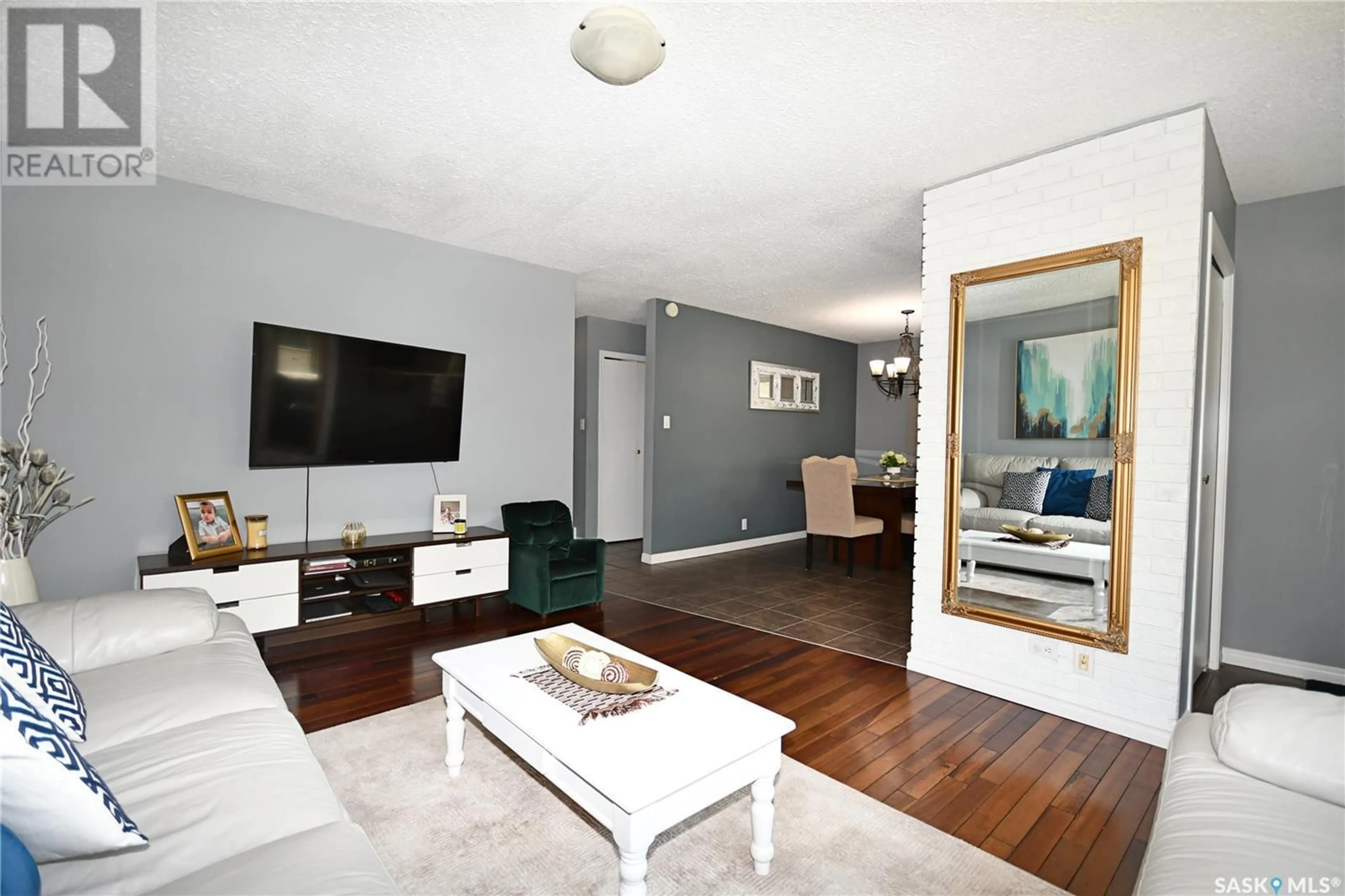 Living room with furniture, wood/laminate floor for 1438 2ND STREET, Prince Albert Saskatchewan S6V0H5