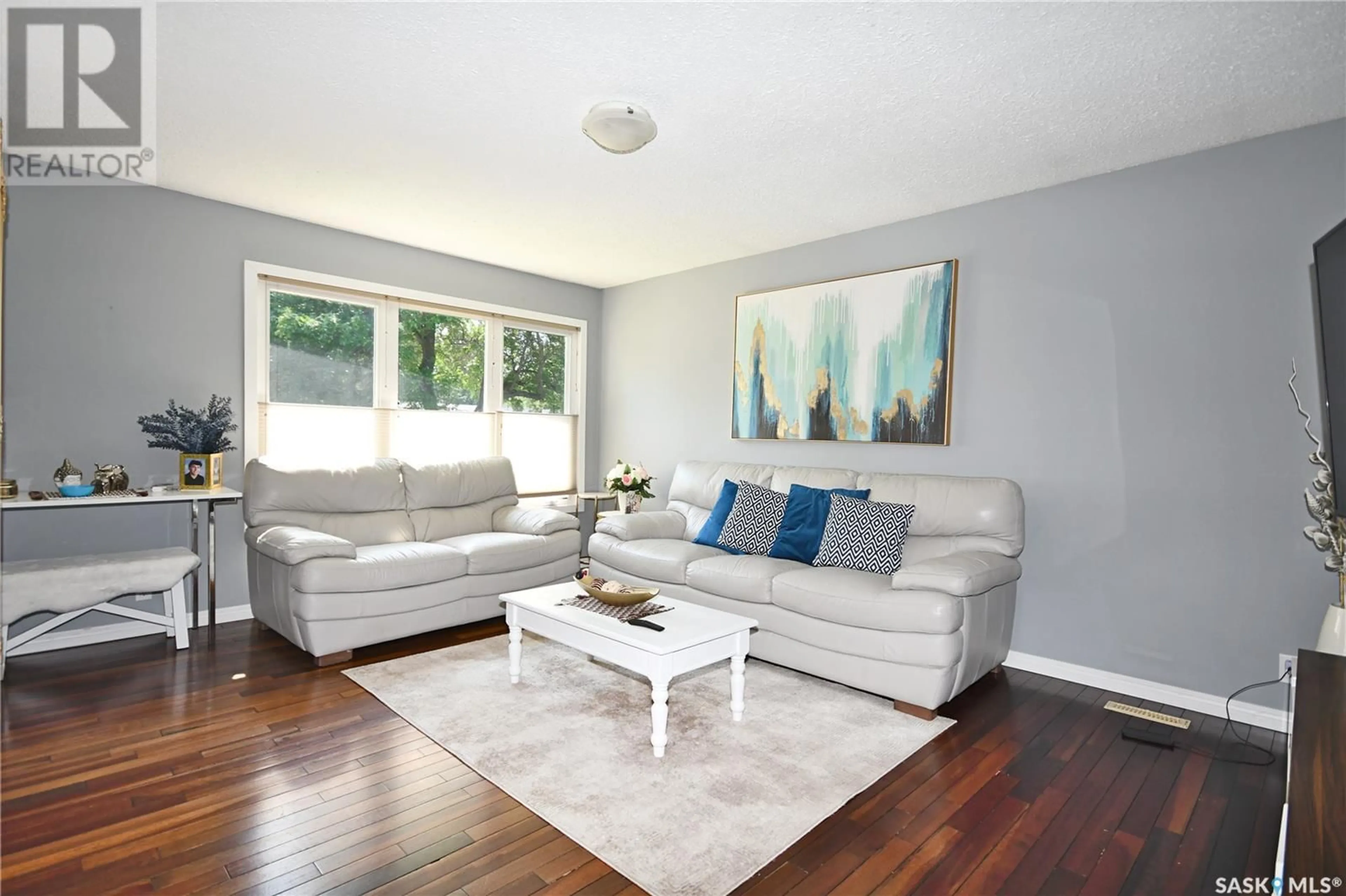 Living room with furniture, wood/laminate floor for 1438 2ND STREET, Prince Albert Saskatchewan S6V0H5