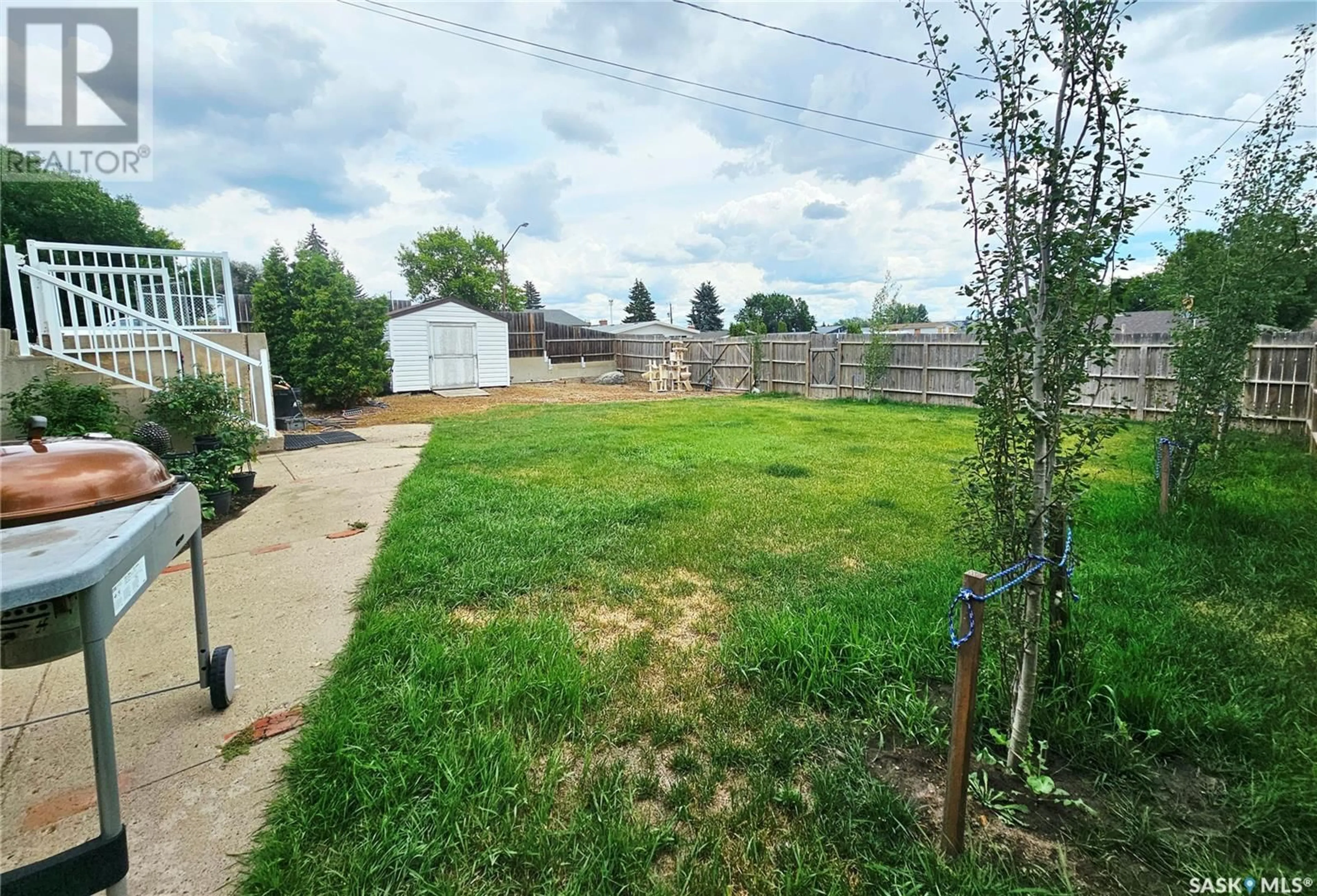 A pic from outside/outdoor area/front of a property/back of a property/a pic from drone, street for E - 1660 BELL STREET, Swift Current Saskatchewan S9H1S7