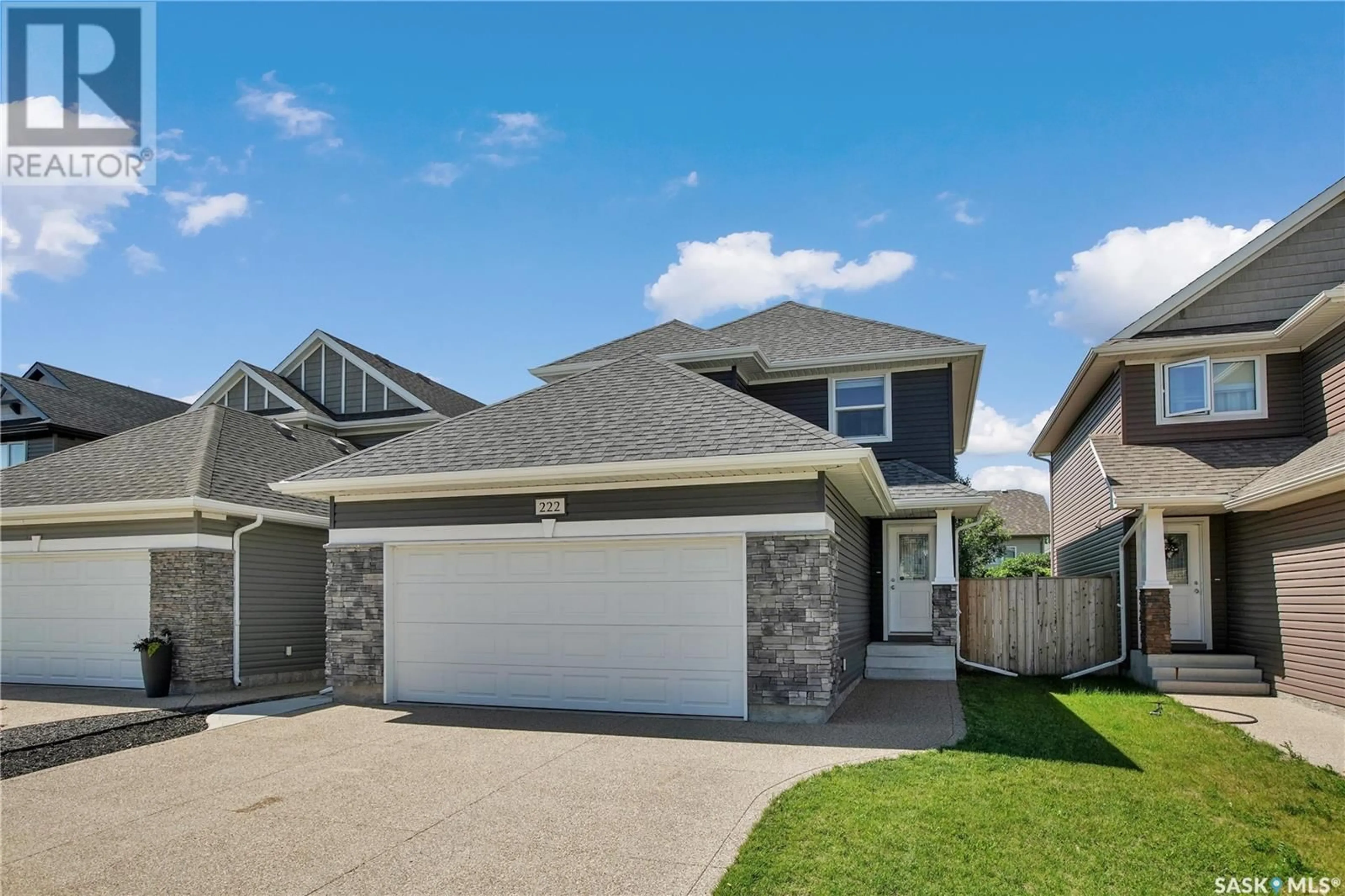 Home with vinyl exterior material, street for 222 LEWIN CRESCENT, Saskatoon Saskatchewan S7T0T3