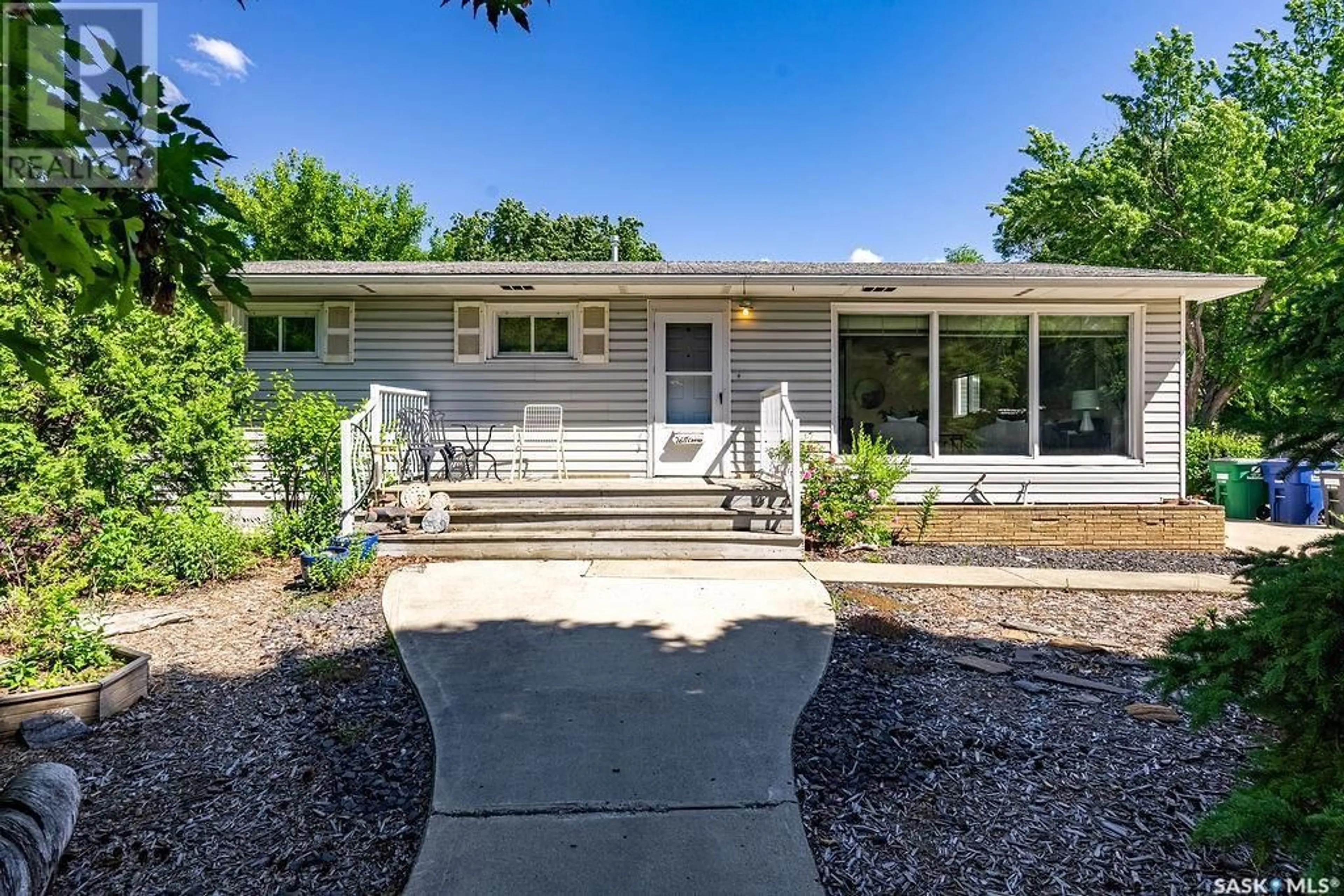 Home with vinyl exterior material, street for 2611 CAIRNS AVENUE, Saskatoon Saskatchewan S7J1V6