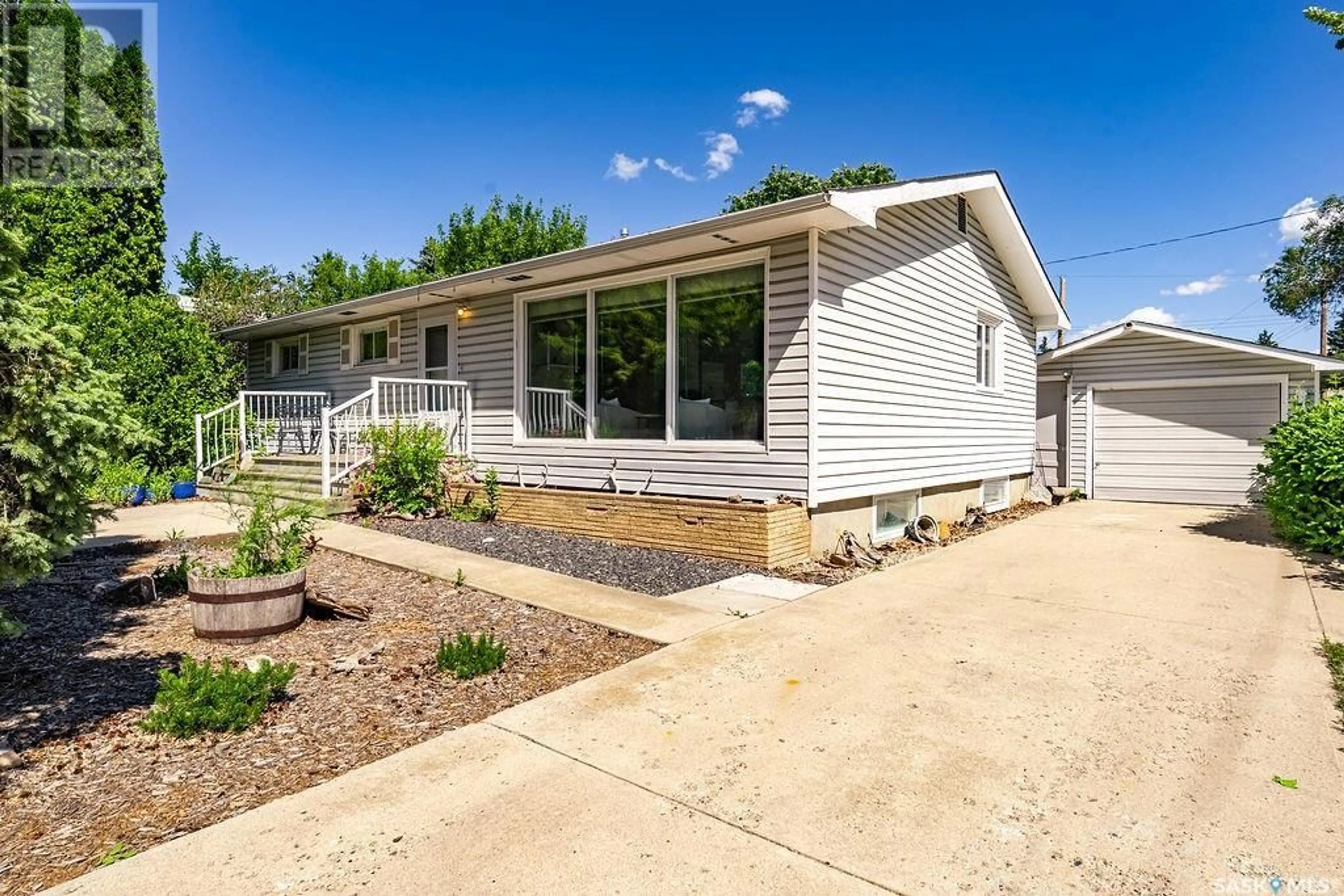 Home with vinyl exterior material, street for 2611 CAIRNS AVENUE, Saskatoon Saskatchewan S7J1V6