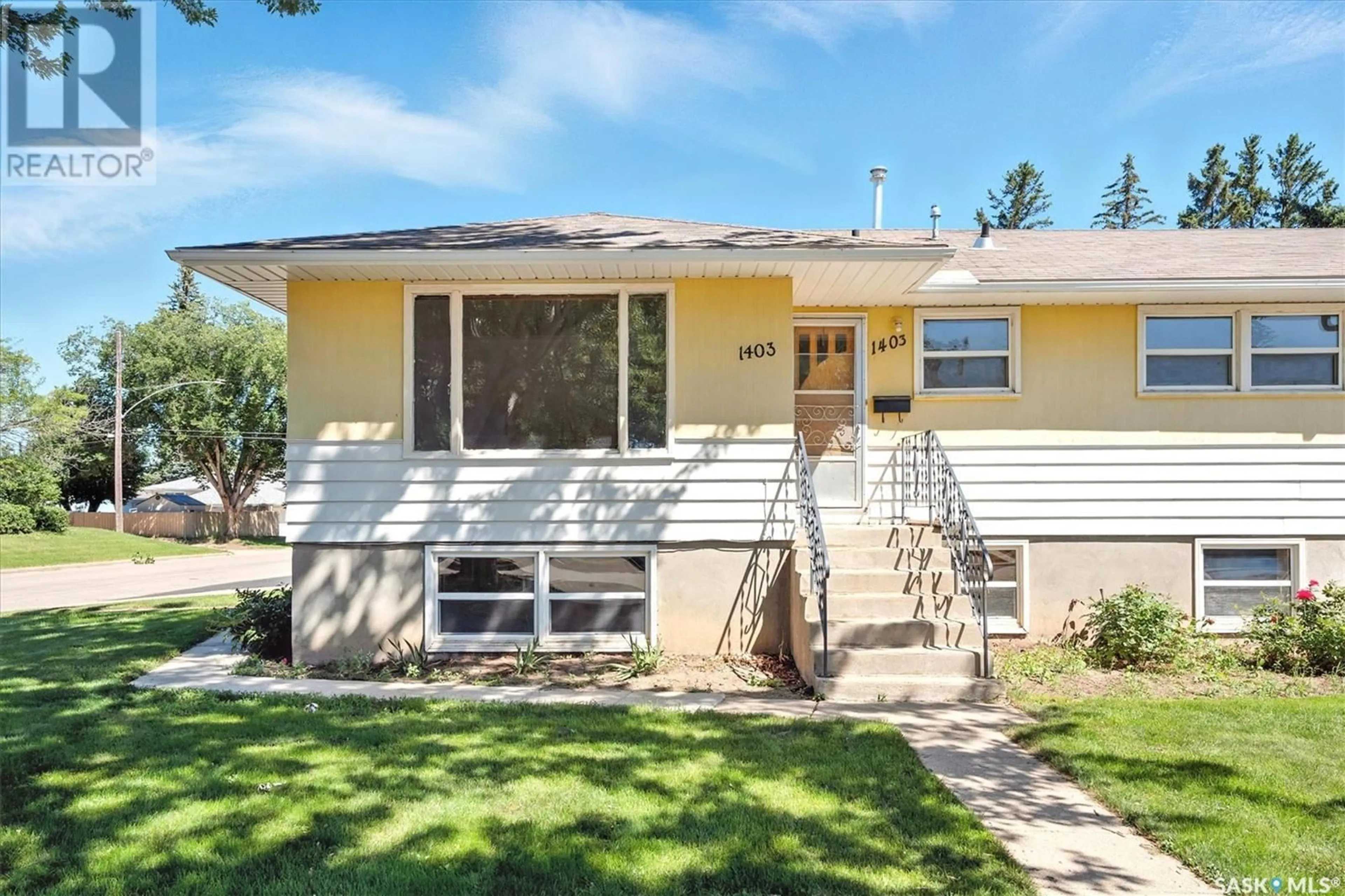 Home with vinyl exterior material, street for 1403/1405 11TH STREET, Saskatoon Saskatchewan S7H0G7