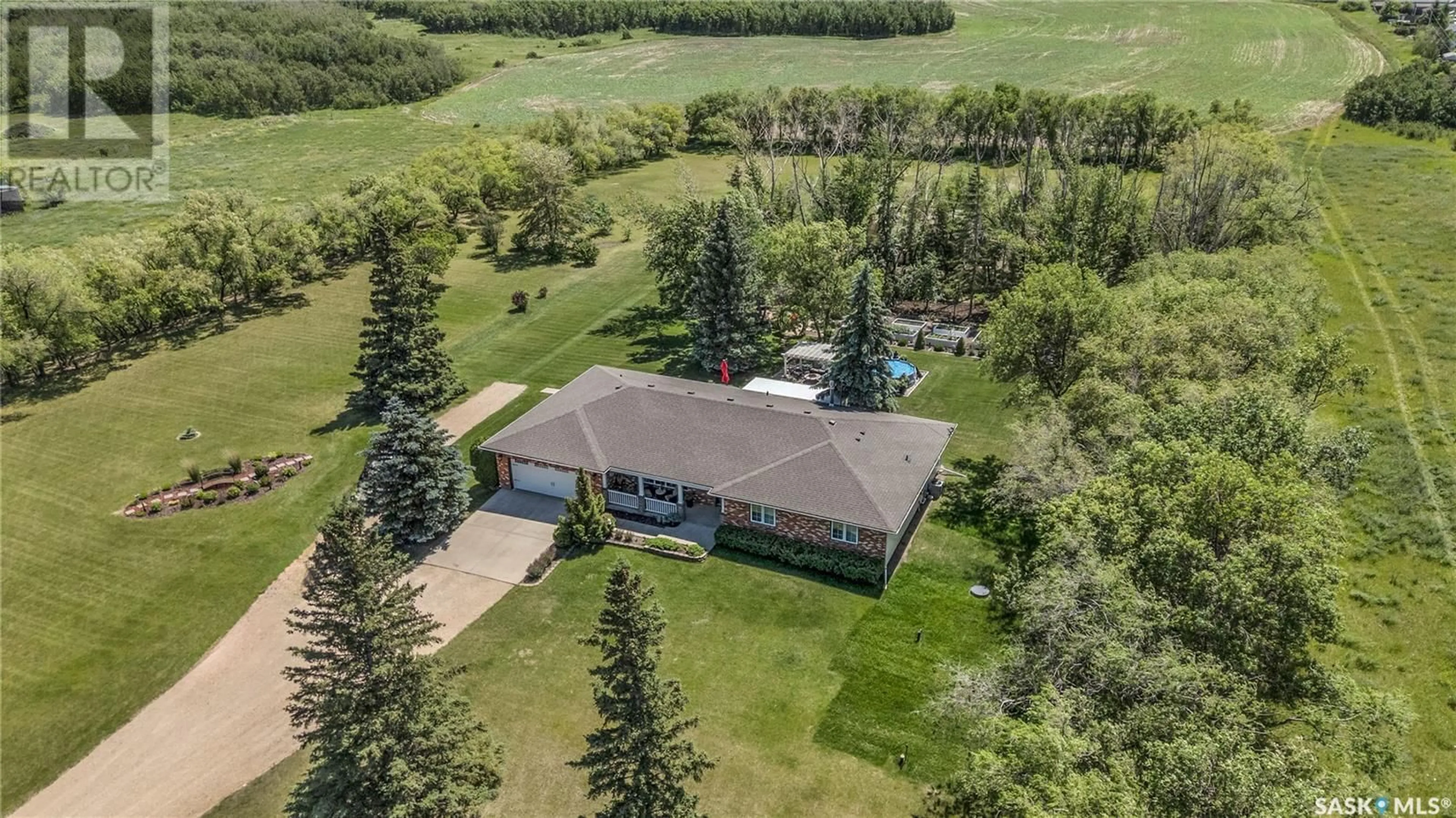A pic from outside/outdoor area/front of a property/back of a property/a pic from drone, unknown for 5 HIGHWAY ACREAGE, Blucher Rm No. 343 Saskatchewan S0K3W0